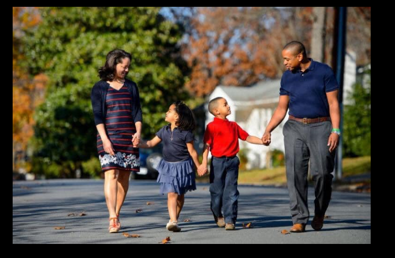 Justin, Cerina, Cameron and Carys Fairfax walk hand-in-hand down a quiet street, sharing a relaxed family moment outdoors. | Source: Facebook/JustinFairfax