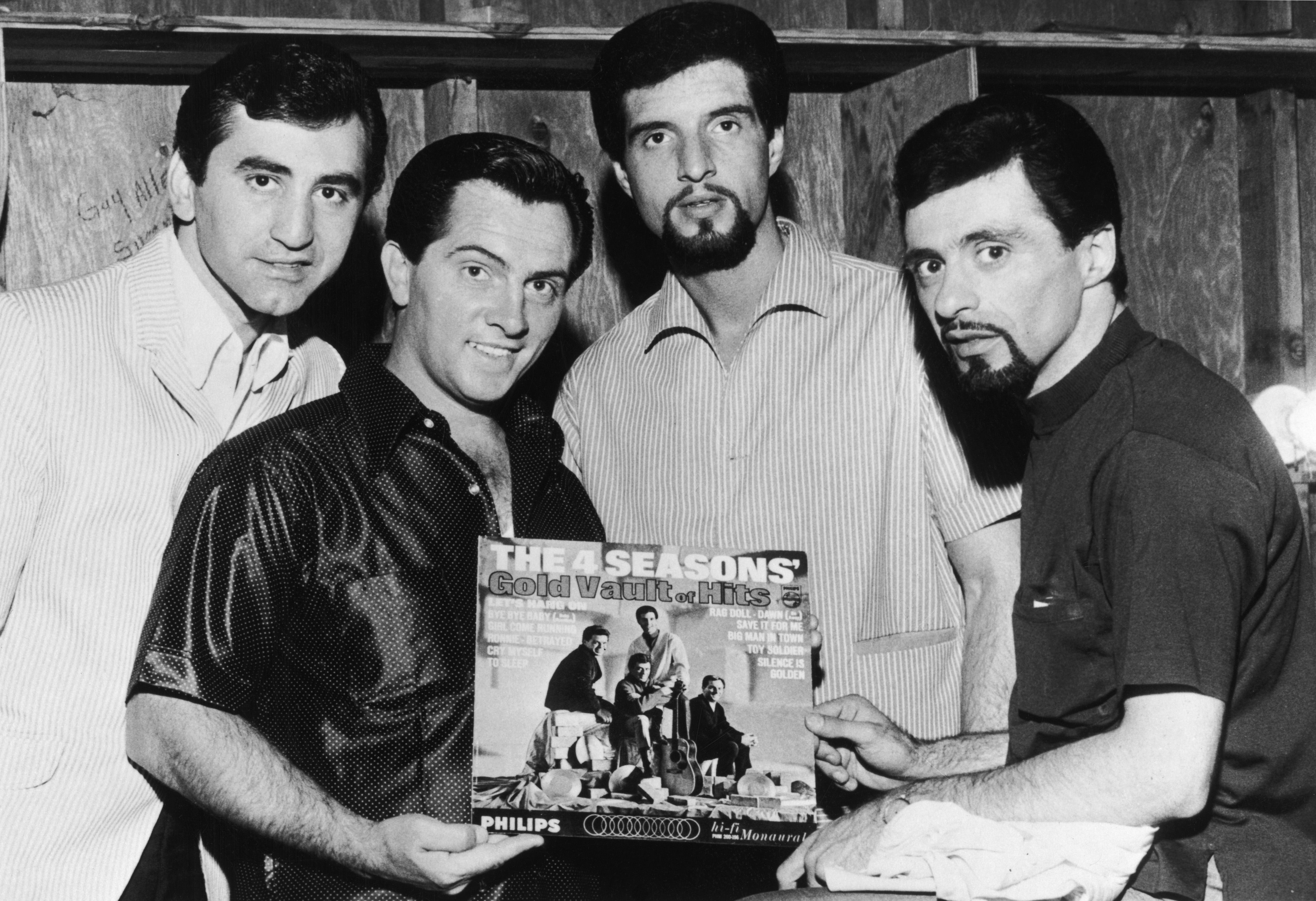 Joe Long, Tommy DeVito, Bob Gaudio, and Frankie Valli of The Four Seasons with their album "The 4 Seasons Gold Vault of Hits," circa 1966 | Source: Getty Images