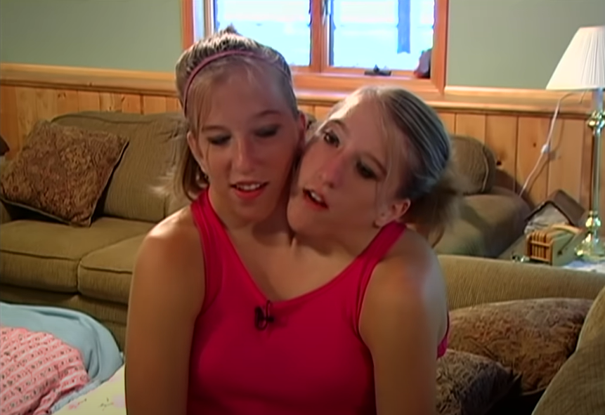 Abby and Brittany Hensel, from a video post dated December 2, 2022 | Source: YouTube/Origin