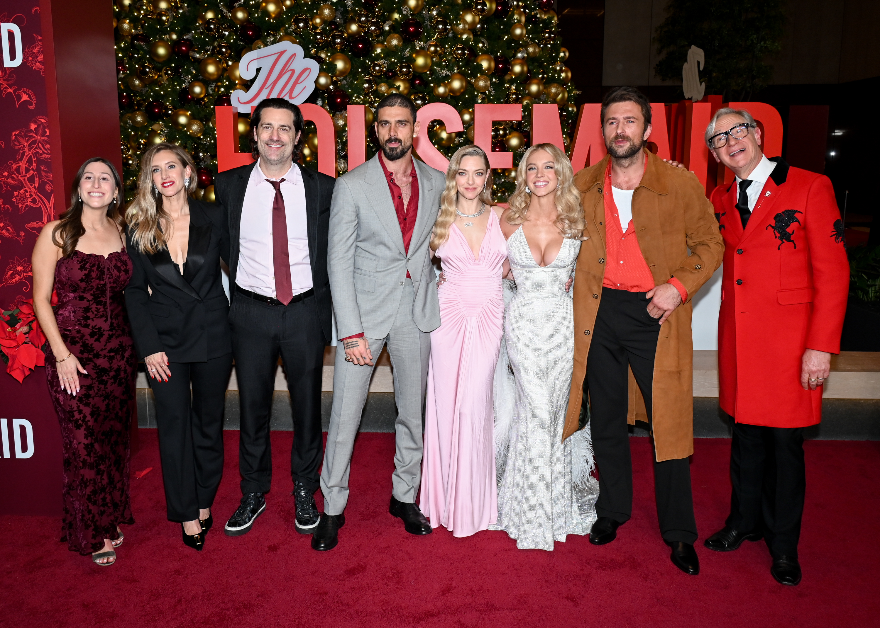 Amanda Seyfried and Sydney Sweeney join cast and crew at the screening, including Michele Morrone, Brandon Sklenar, Todd Lieberman, and director Paul Feig, all smiles before the film's debut.