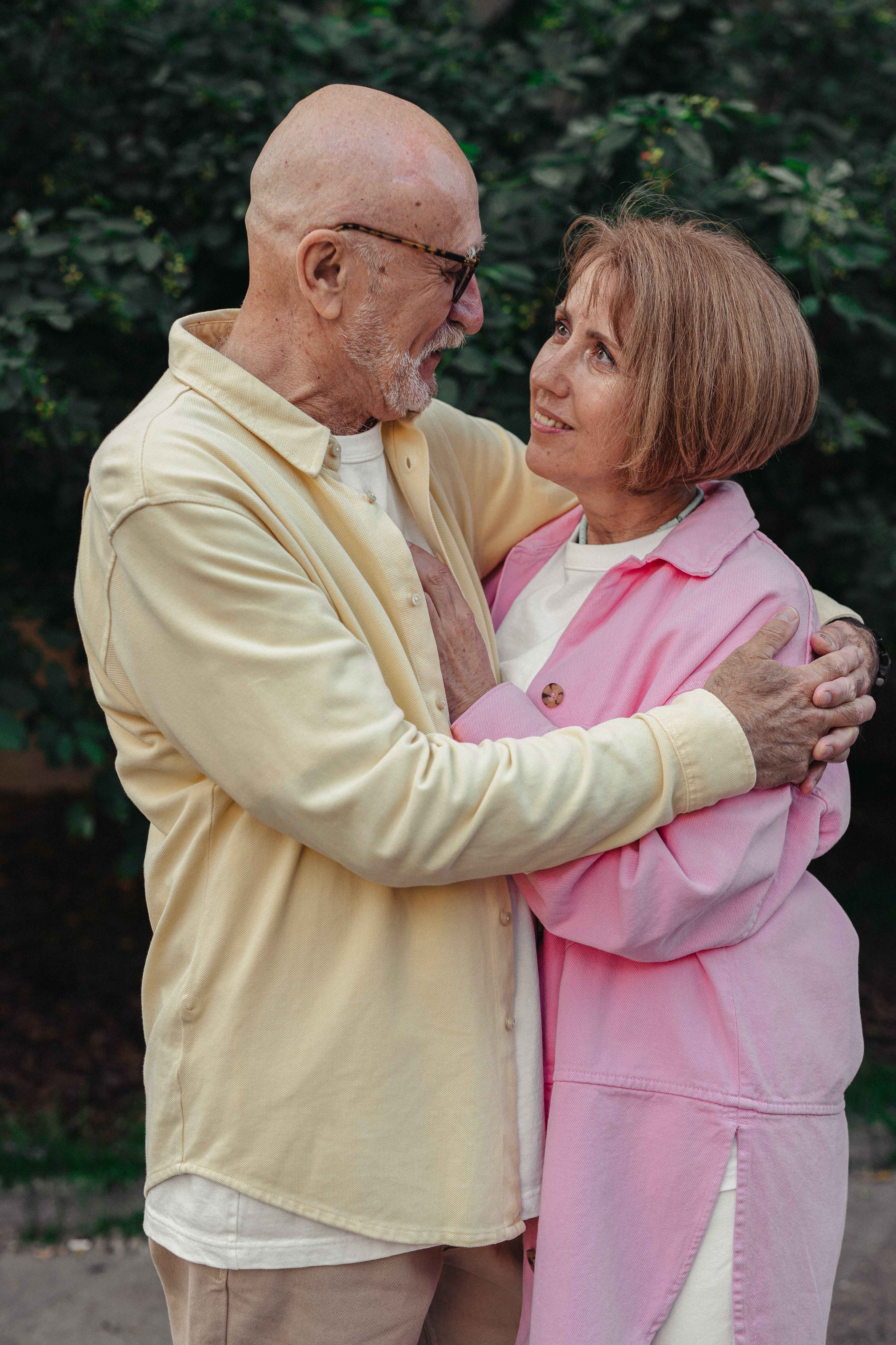 An elderly couple hugging and looking at each other | Source: Pexels
