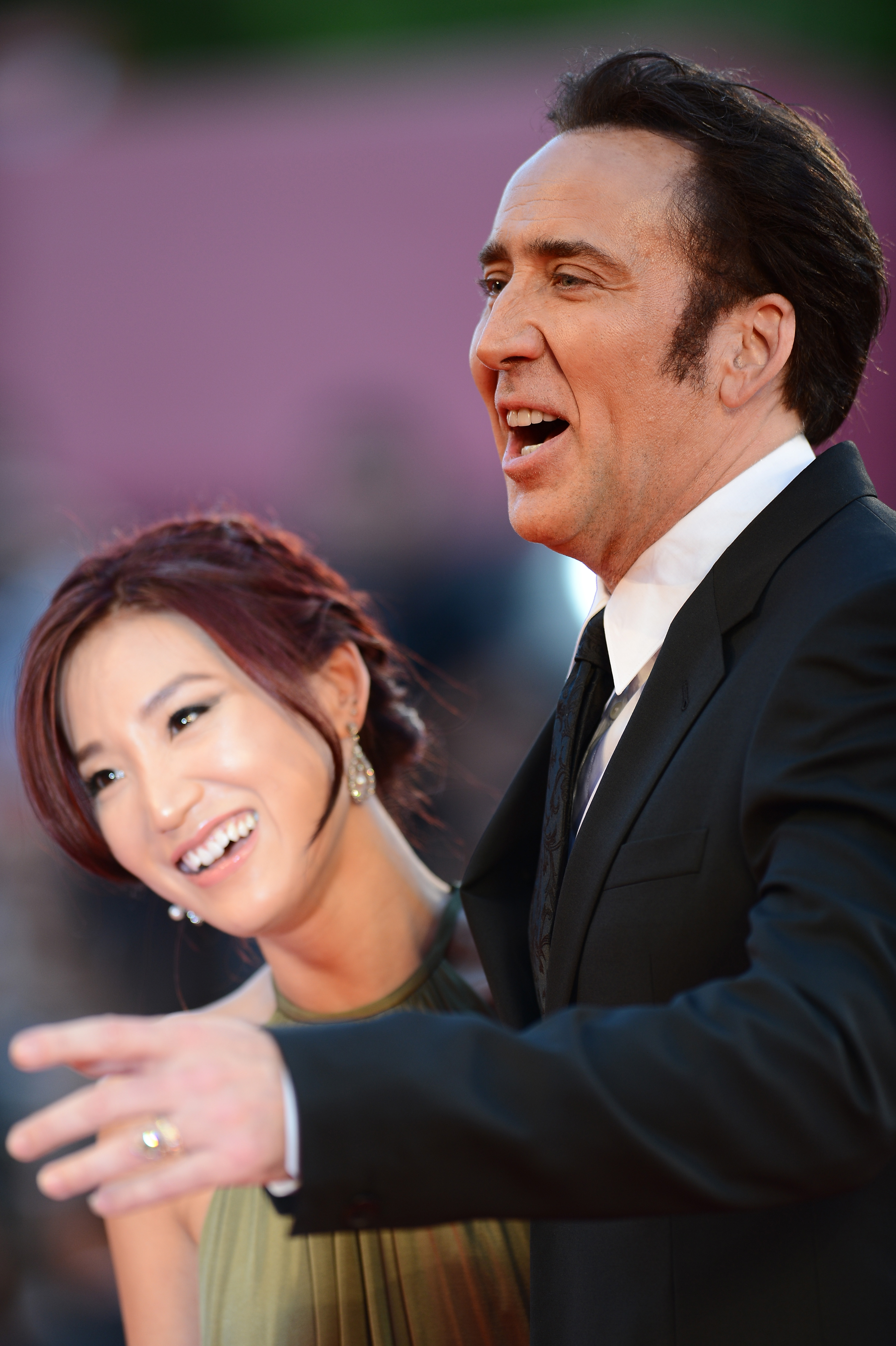 Nicolas Cage and Alice Kim attending the "Joe" premiere at the 70th Venice International Film Festival in Venice, Italy, on August 30, 2013 | Source: Getty Images