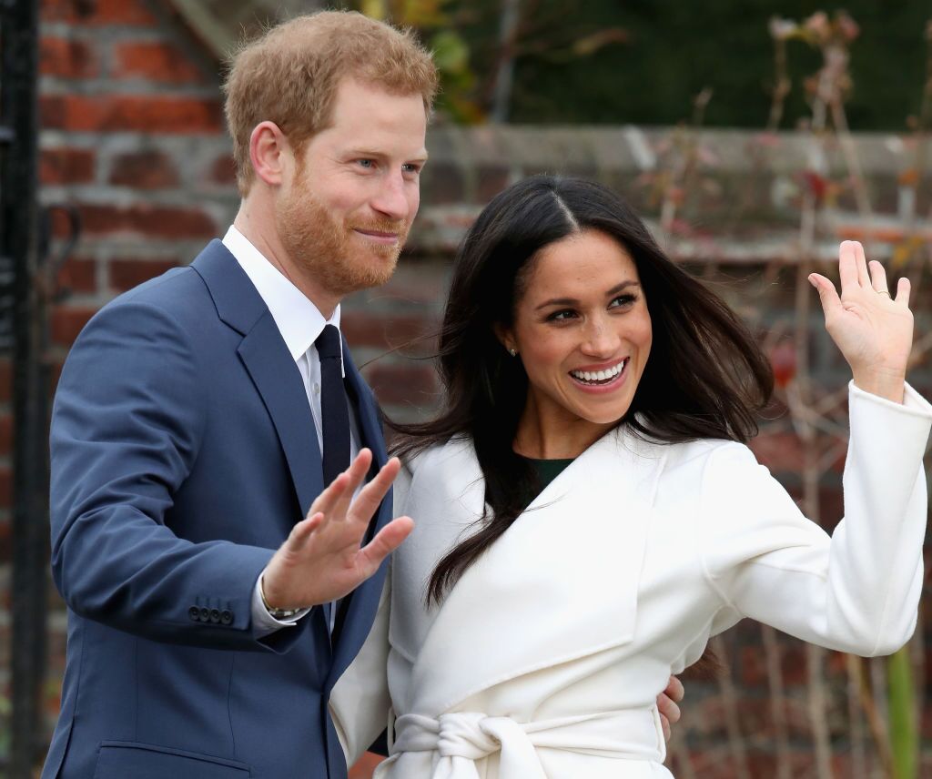 Prince Harry and Meghan Markle during an official photocall to announce the engagement of Prince Harry and actress Meghan Markle at The Sunken Gardens at Kensington Palace on November 27, 2017. | Source: Getty Images
