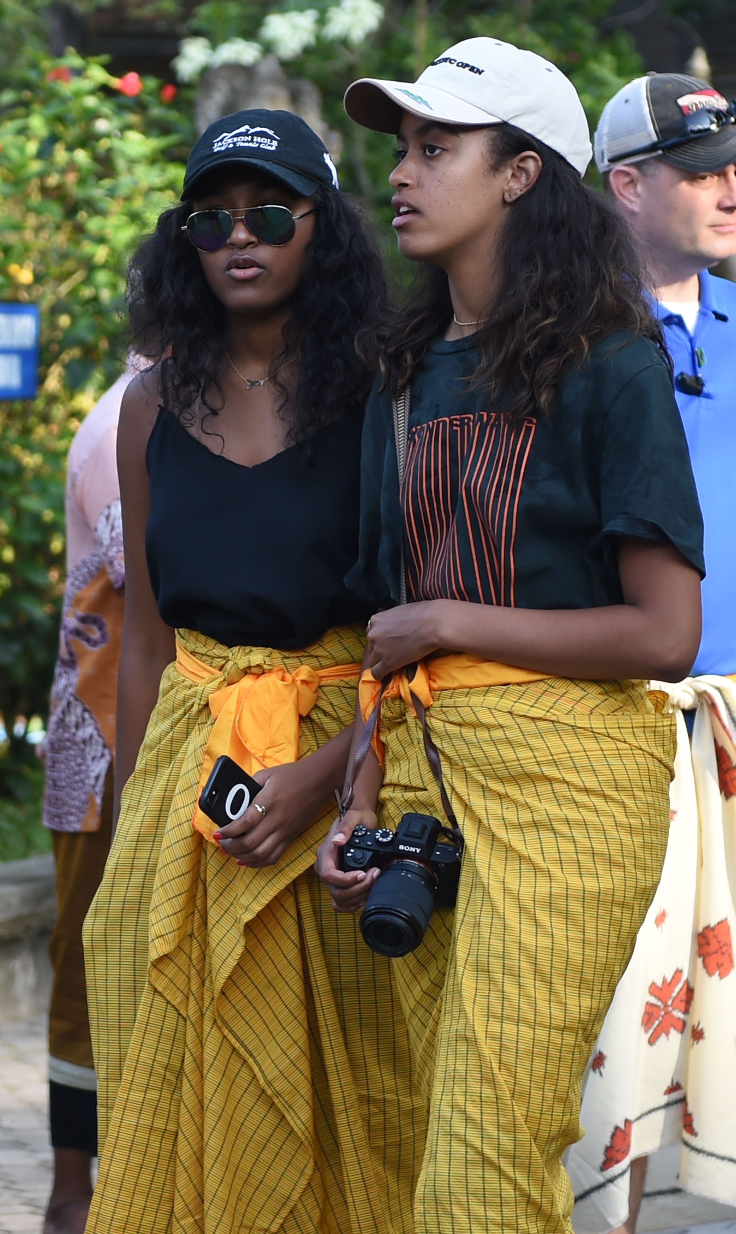 Sasha and Malia, daughters of former US president Barack Obama, visit Tirtha Empul temple at Tampaksiring Village in Gianyar on the Indonesian resort island of Bali on June 27, 2017. | Source: Getty Images