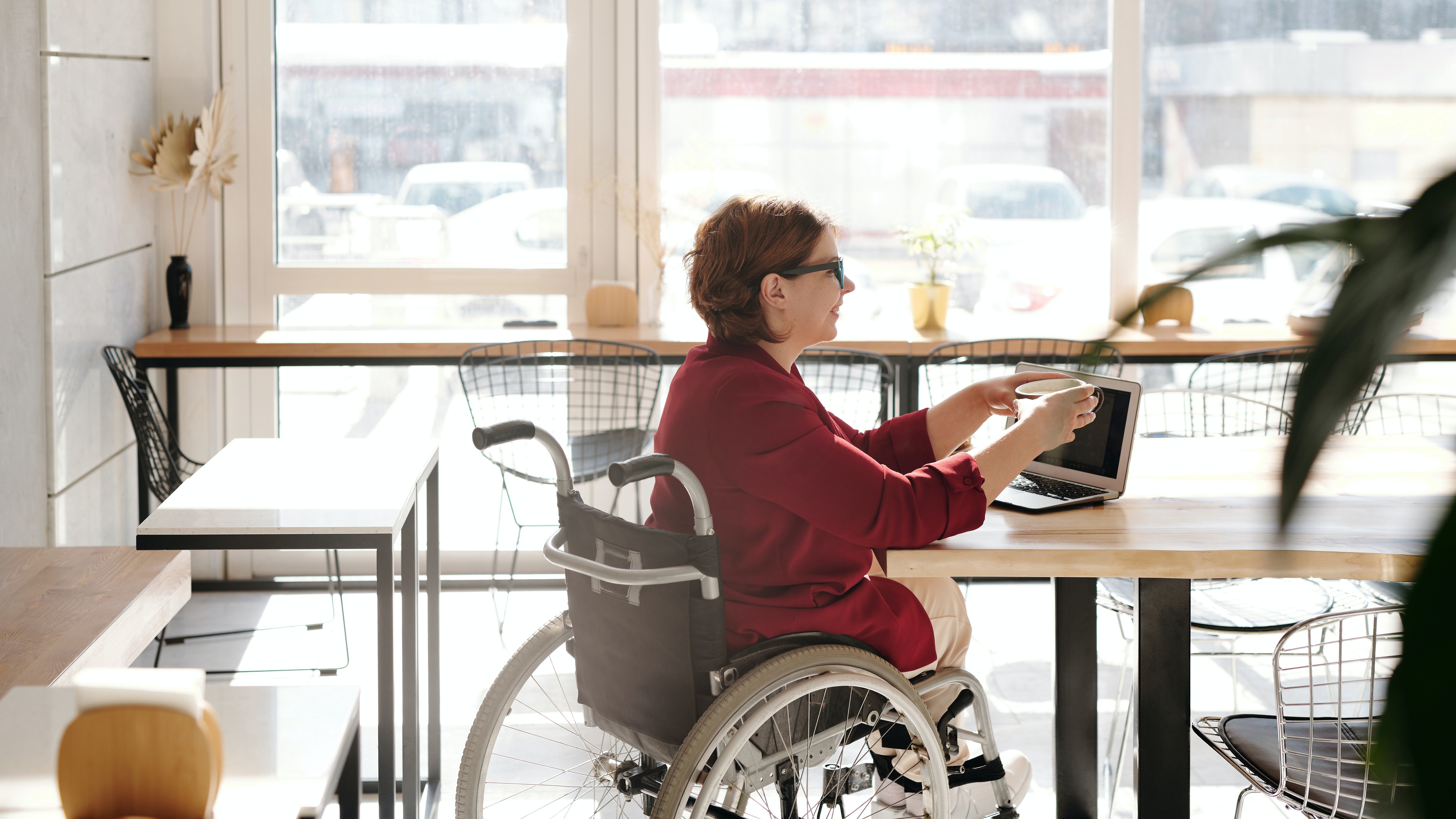 A woman in red blazer sitting on wheelchair. | Source: Pexels