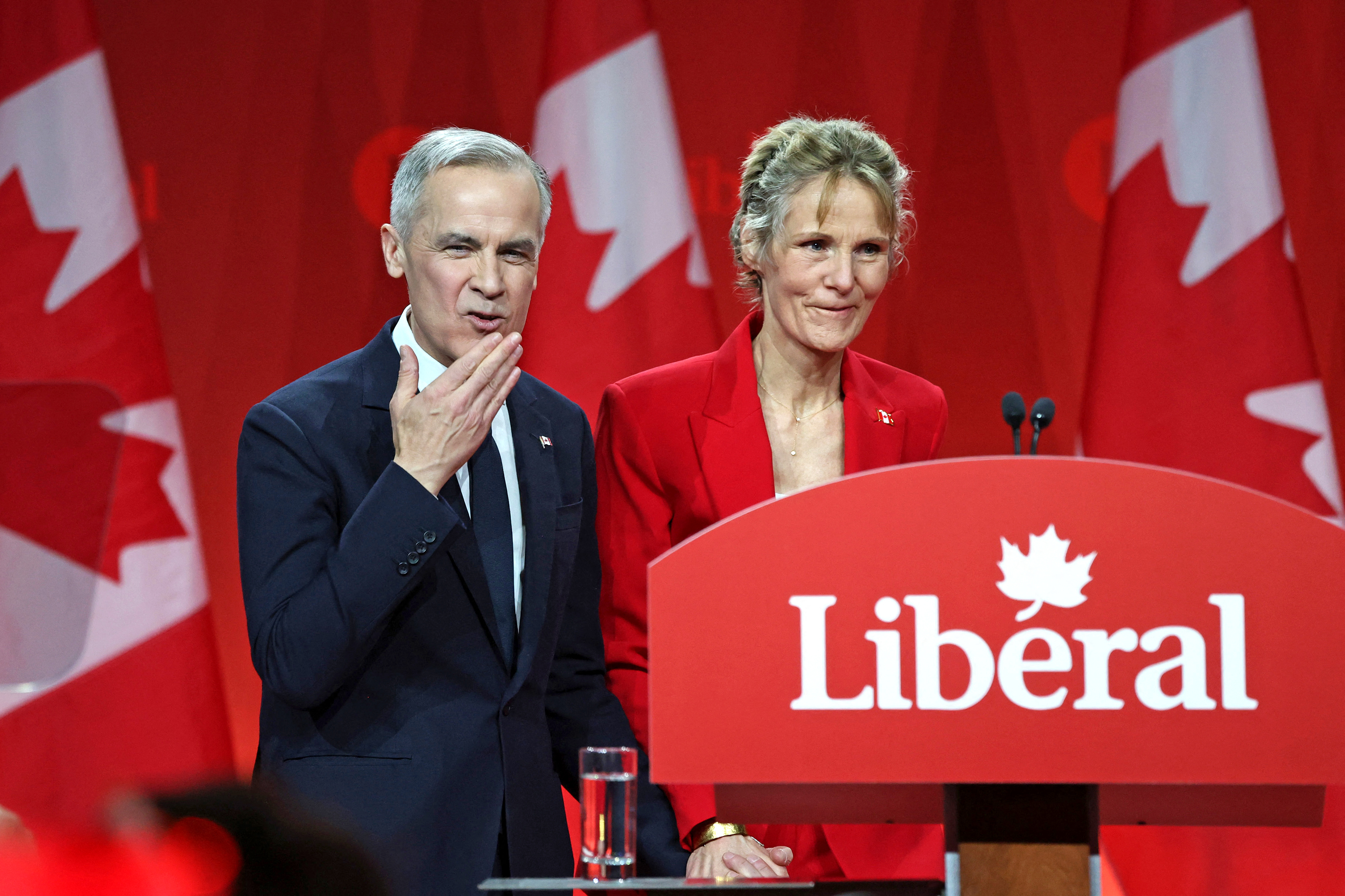 Mark Carney alongside his wife Diana Fox Carney, gestures at supporters after being elected as the new Liberal Party leader, in Ottawa, Canada, on March 9, 2025 | Source: Getty Images