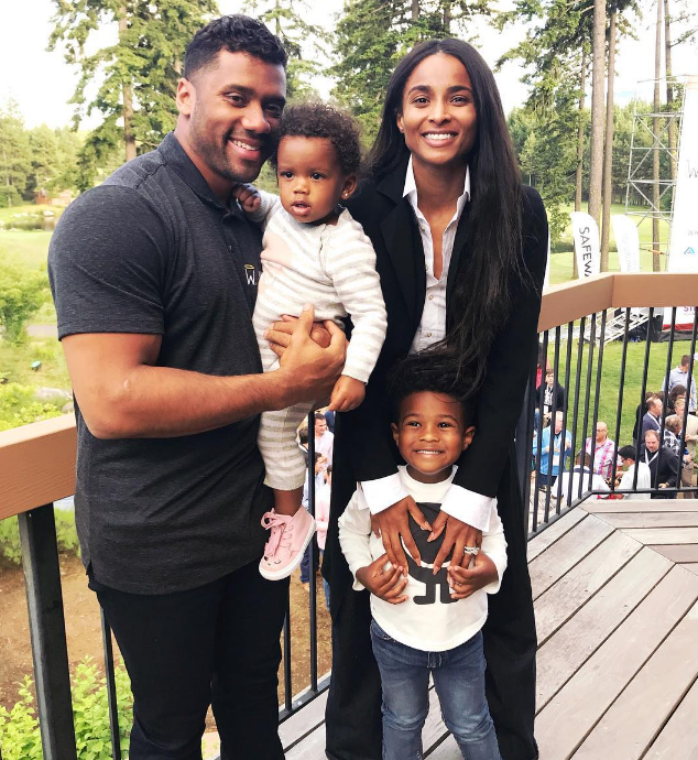 Ciara and Russell Wilson with Future Zahir Wilburn and Sienna Wilson posing on a porch deck for a charity event on June 27, 2018 | Source: Instagram/ciara