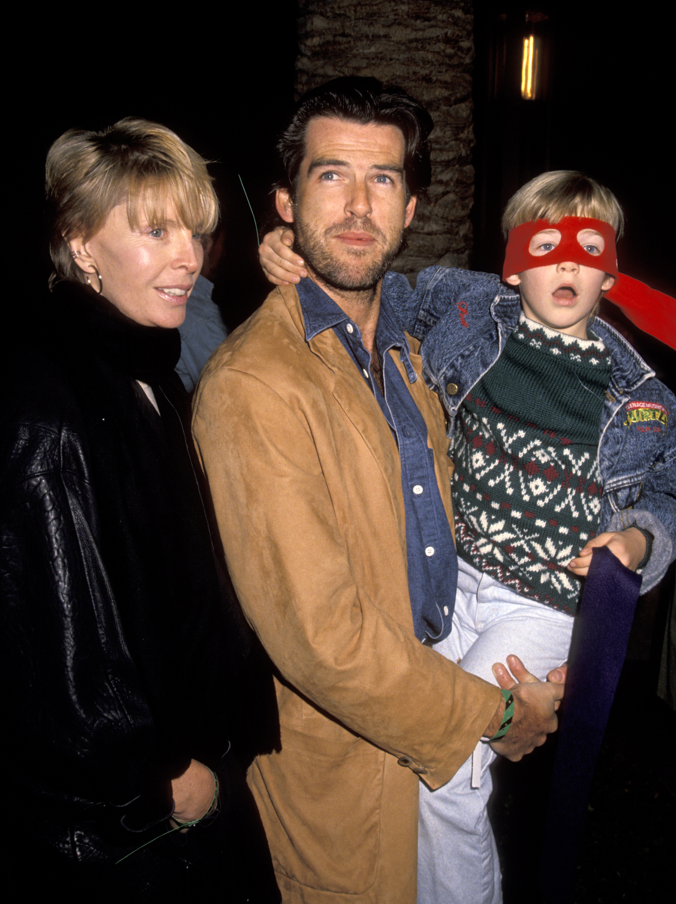 Cassandra Harris, Pierce Brosnan, and Sean Brosnan at the "Teenage Mutant Ninja Turtles" premiere in 1990. | Source: Getty Images