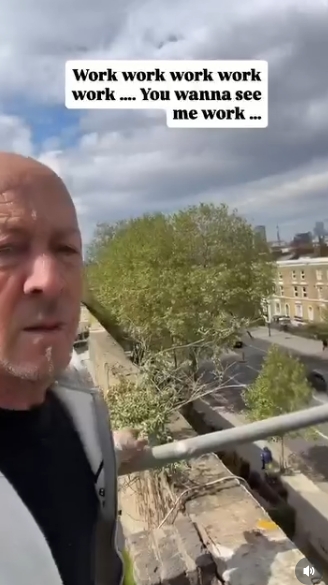 Looking out over the edge of the building, Hendy briefly shifts the view to the streets below, revealing a leafy neighbourhood beyond the construction site. The clip blends personal perspective with his working environment, once again paired with the text "Work work work work work .... You wanna see me work ...". | Source: Instagram/johnhendyeast17_official