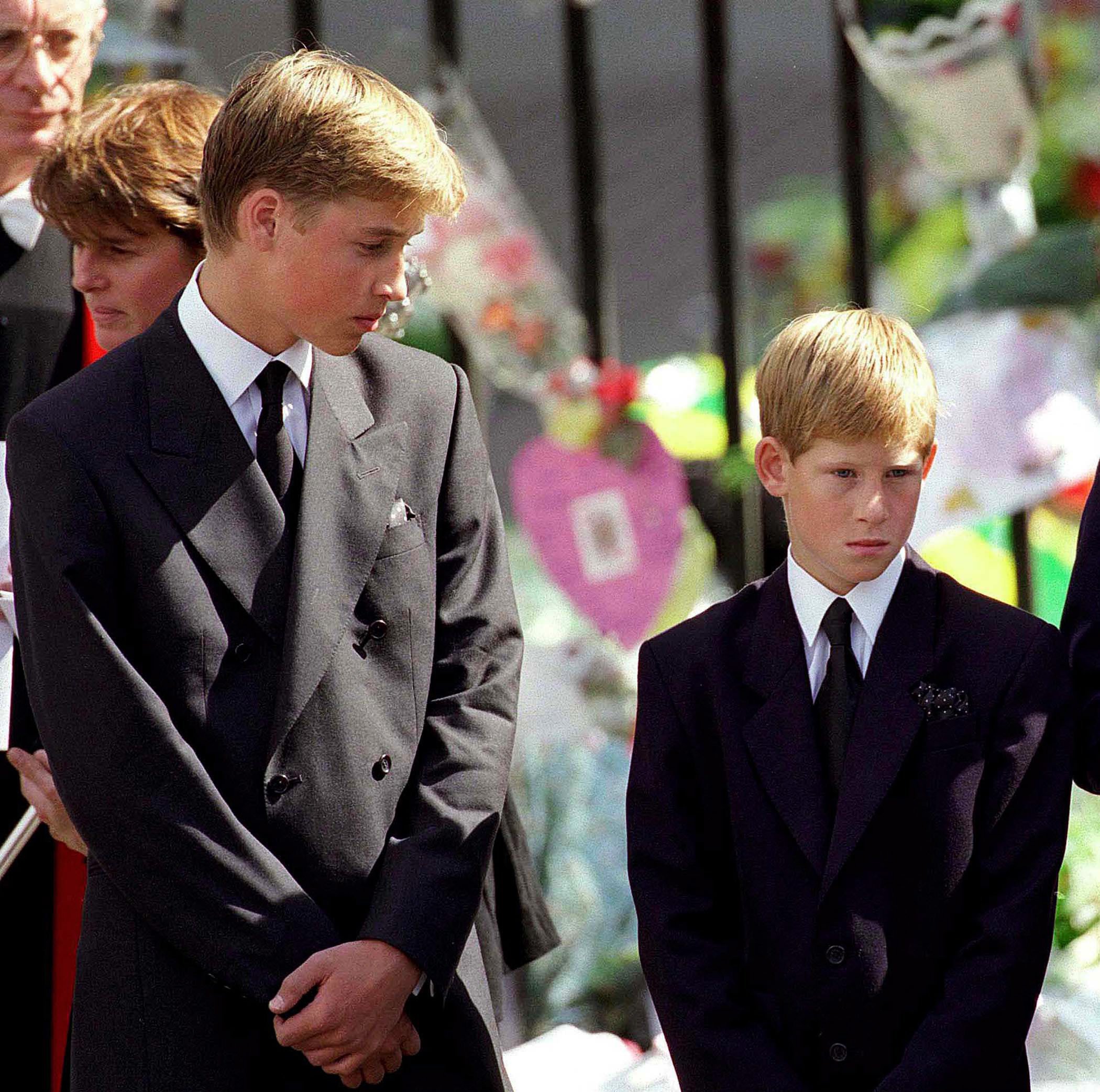 Prince William and Prince Harry stand outside Westminster Abbey at the funeral of Princess Diana on September 6, 1997, in London, England. | Source: Getty Images