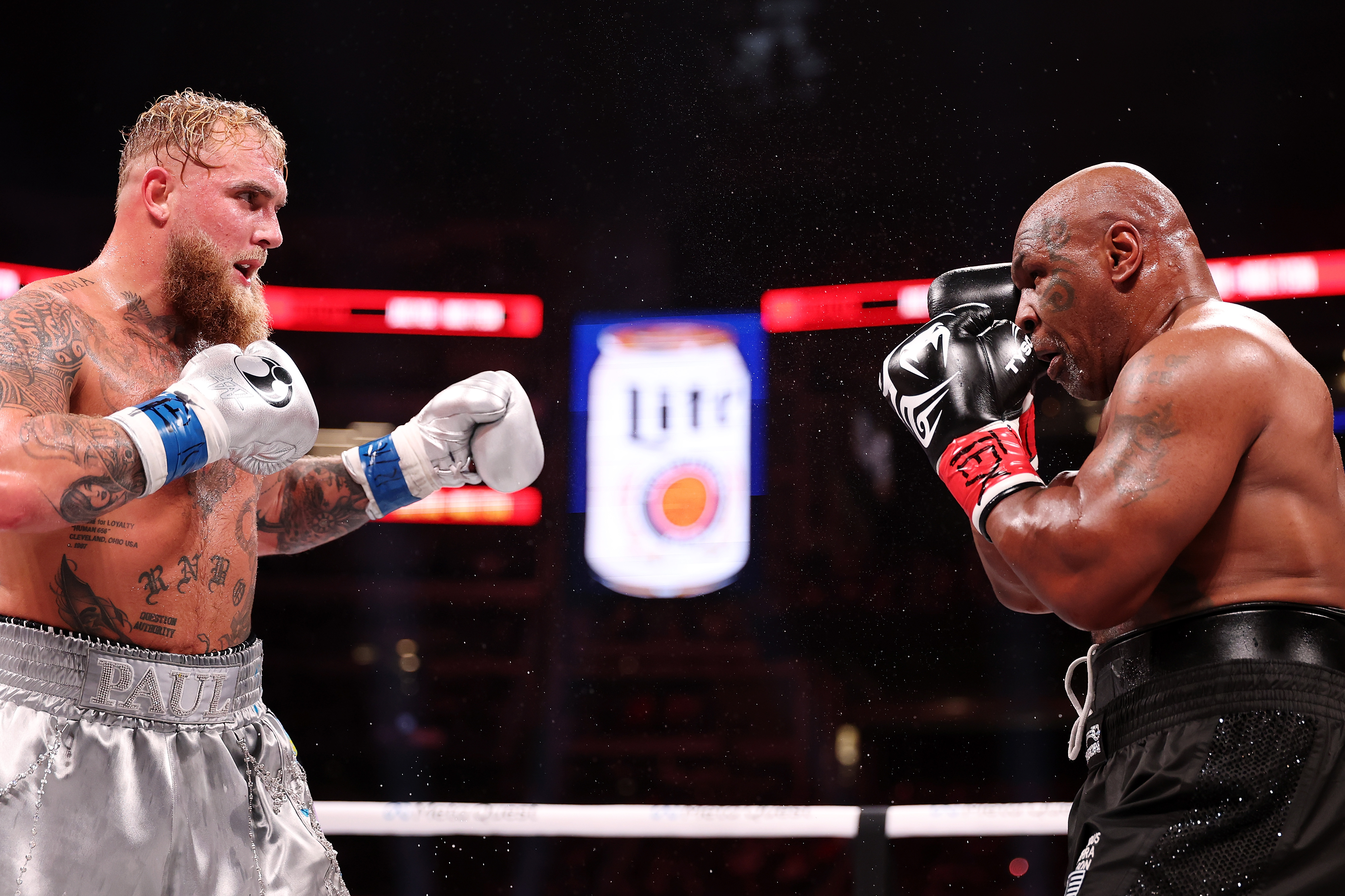 Jake Paul and Mike Tyson fight during LIVE On Netflix: Jake Paul vs. Mike Tyson at AT&T Stadium in Arlington, Texas, on November 15, 2024 | Source: Getty Images