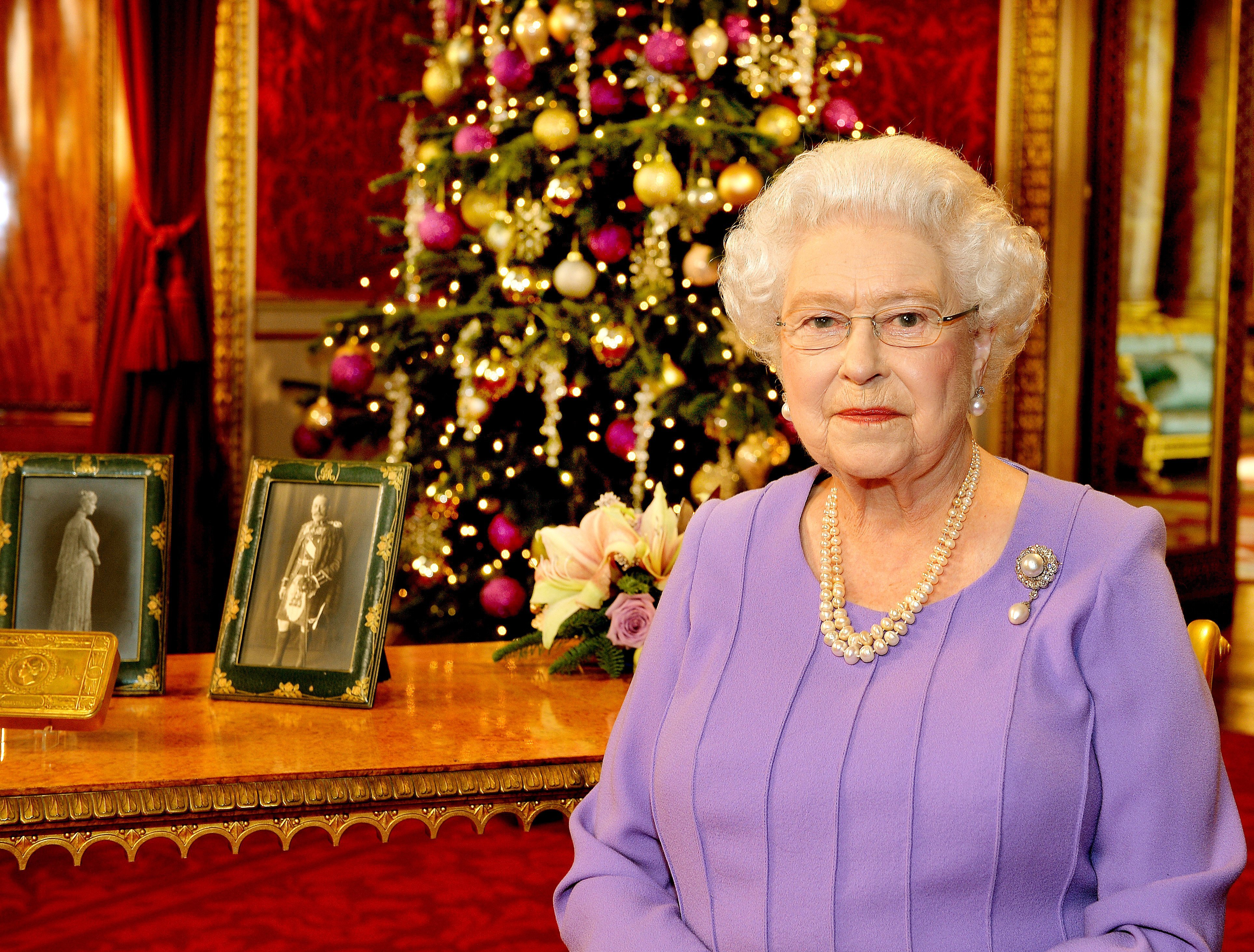  Queen Elizabeth II poses in the State Dining Room of Buckingham Palace after recording her Christmas Day television broadcast to the Commonwealth on December 10, 2014, in London. | Source: Getty Images.