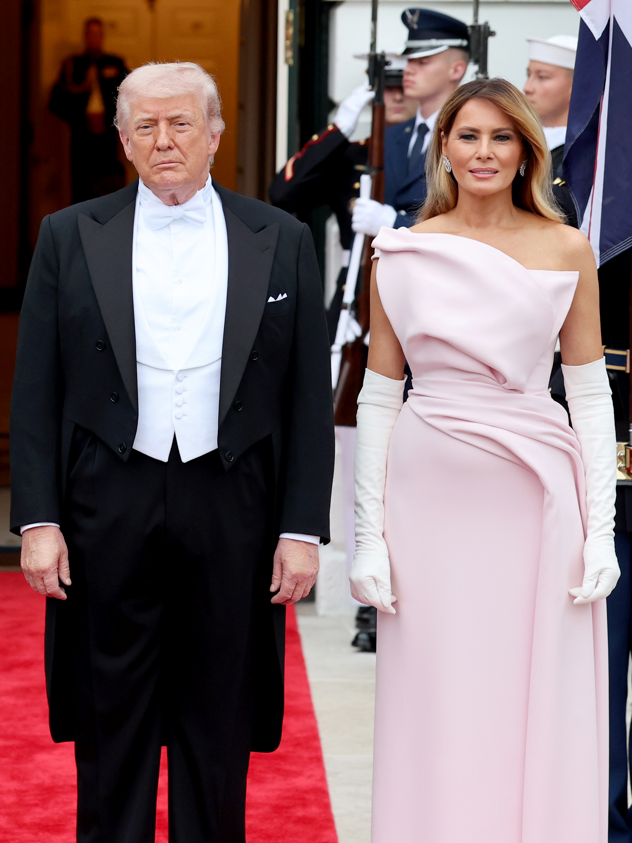 Donald and Melania Trump pose outside during an official state dinner hosted at The White House on day two of the State Visit of King Charles III and Queen Camilla to the US, on April 28, 2026 in Washington, DC | Source: Getty Images