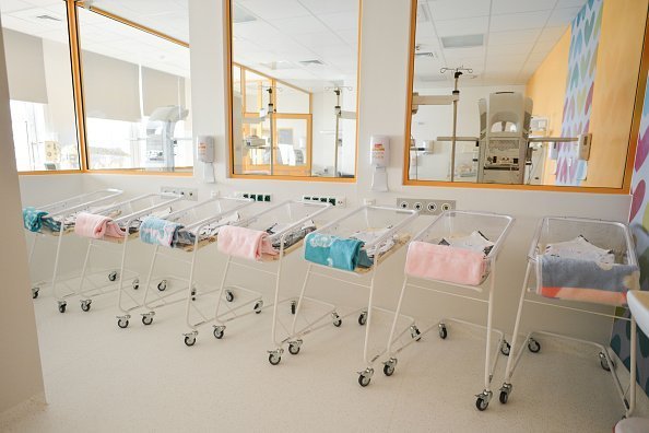A line of baby beds/strollers awaiting to accomodate newborn babies inside a new Center of Maternity and Women's Medicine, opened in Krakow | Photo: Getty Images