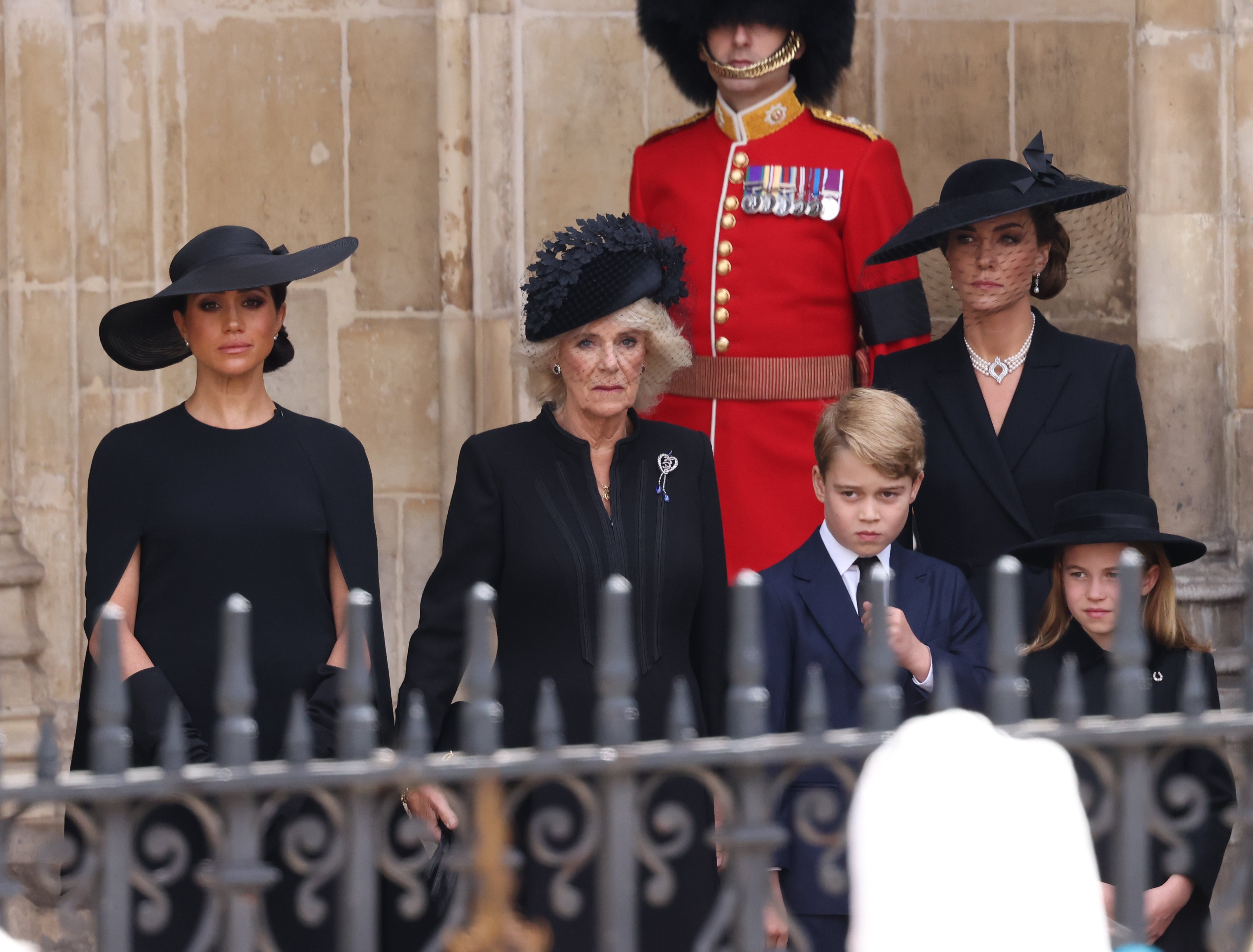 Meghan, Duchess of Sussex, Camilla, Queen Consort, Prince George of Wales, Catherine, Princess of Wales, and Princess Charlotte of Wales during the State Funeral of Queen Elizabeth II at Westminster Abbey on September 19, 2022, in London, England. | Source: Getty Images