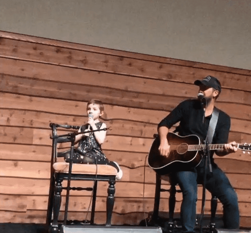 Luke Bryan and Caroline Lantz performing “Sweet Caroline”. | Photo: Instagram/Caroline Bryan