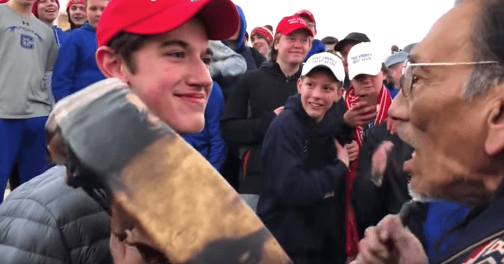 Nick Sandmann and Nathan Phillips facing each other | Photo: On Native Ground