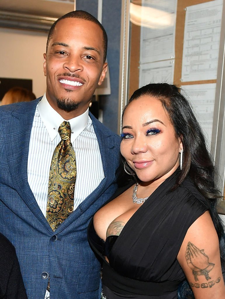 T.I. and Tameka Harris pose backstage during "Between the World and Me" Atlanta premiere at Atlanta Symphony Hall | Photo: Getty Images