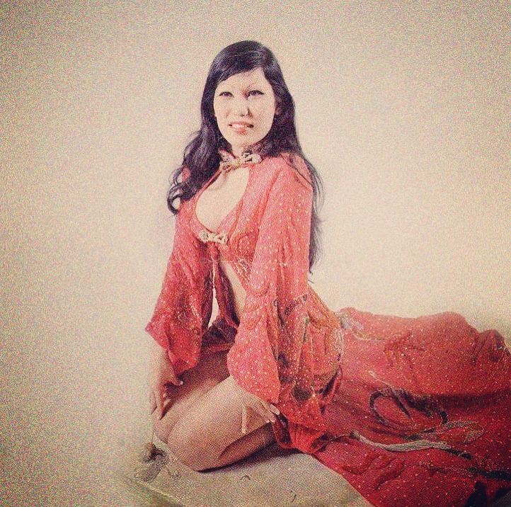 Lyn May posing in a red dress, dated May 2020 | Source: Instagram/lyn_may_