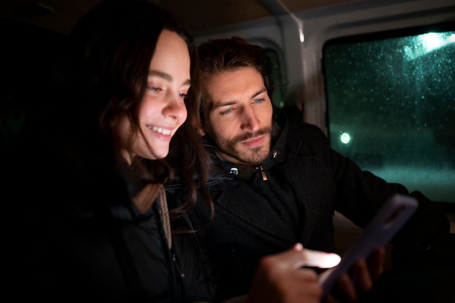 A young couple sitting in a car | Source: Freepik