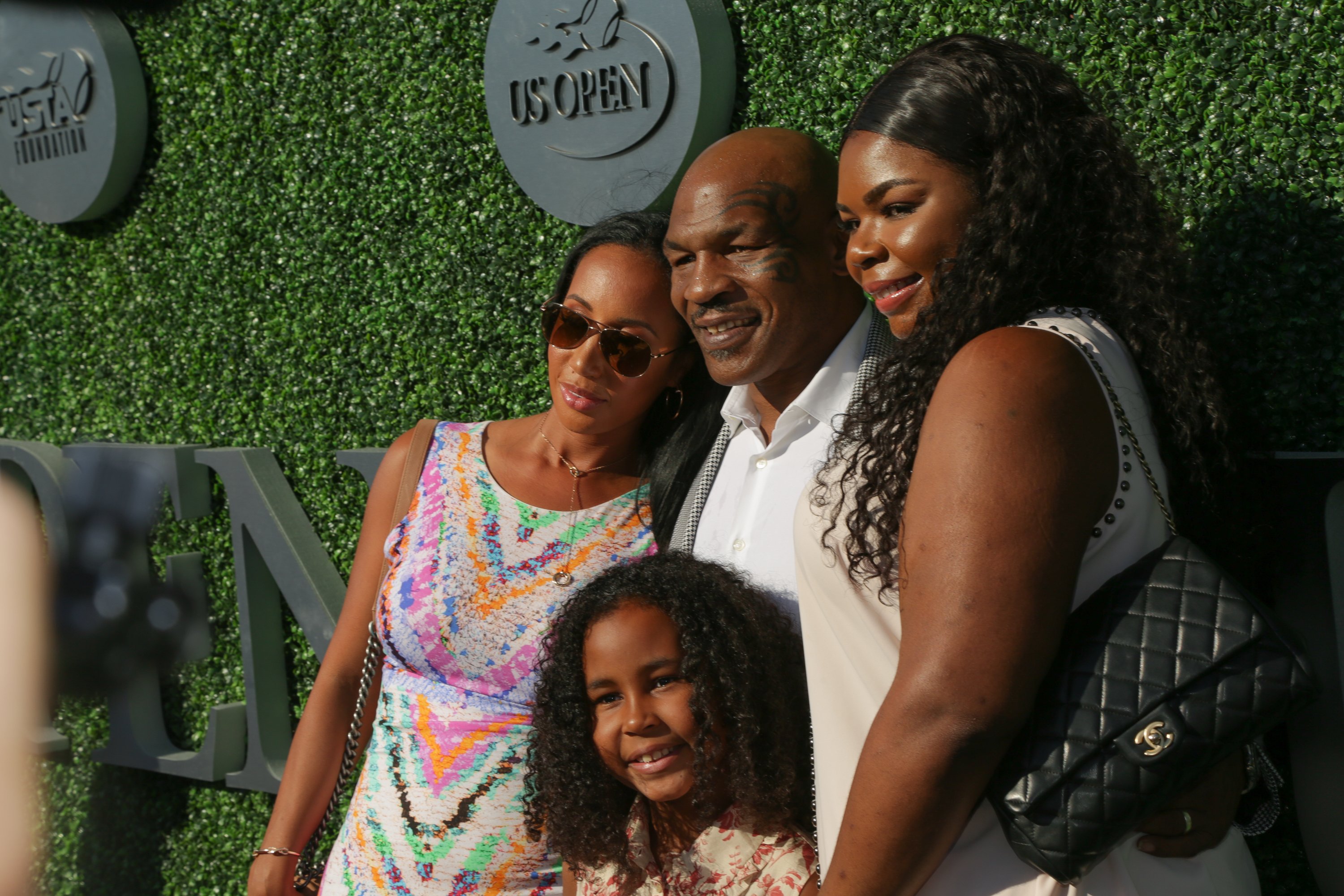 Retired boxing champion Mike Tyson (C) and family attend the 2016 US Open Opening Night held at the USTA Billie Jean King National Tennis Center on August 29, 2016, in New York City. | Source: Getty Images