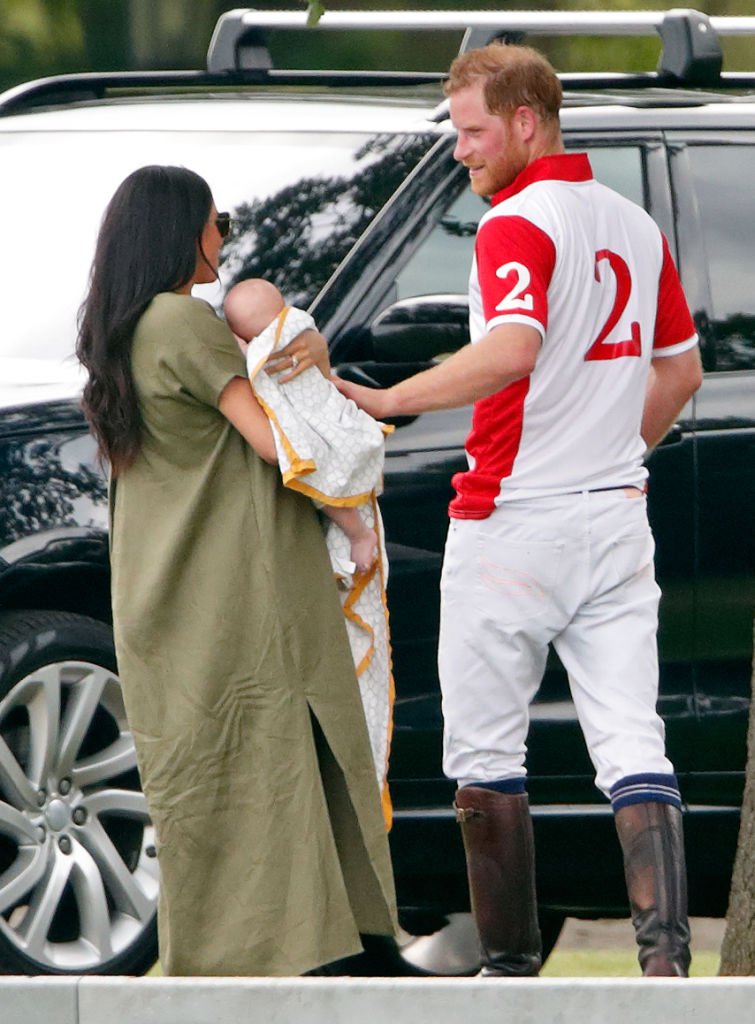 Meghan Markle holds son Archie next to husband Prince Harry while attending the King Power Royal Charity Polo Match in Wokingham, England on July 10, 2019 | Photo: Getty Images
