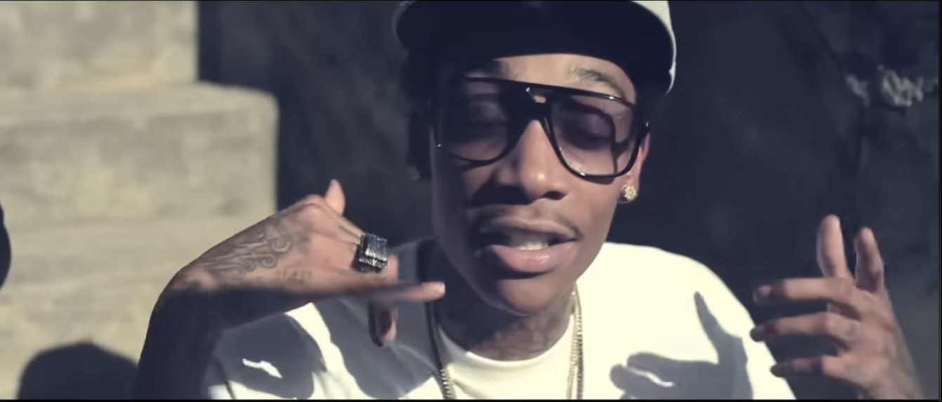 Wiz Khalifa wears aviator sunglasses from his Eyetique collaboration, "The Elevators," in the "Black and Yellow" music video, released on October 11, 2010. | Source: YouTube/Wiz Khalifa