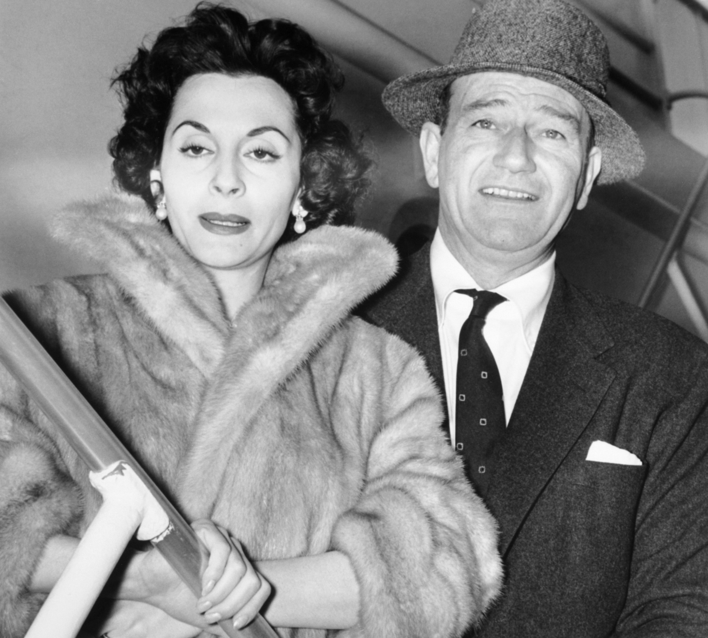 John Wayne and wife, Pilar heading to Tripoli for a short vacation and movie making on November 14 1956 | Source: Getty Images