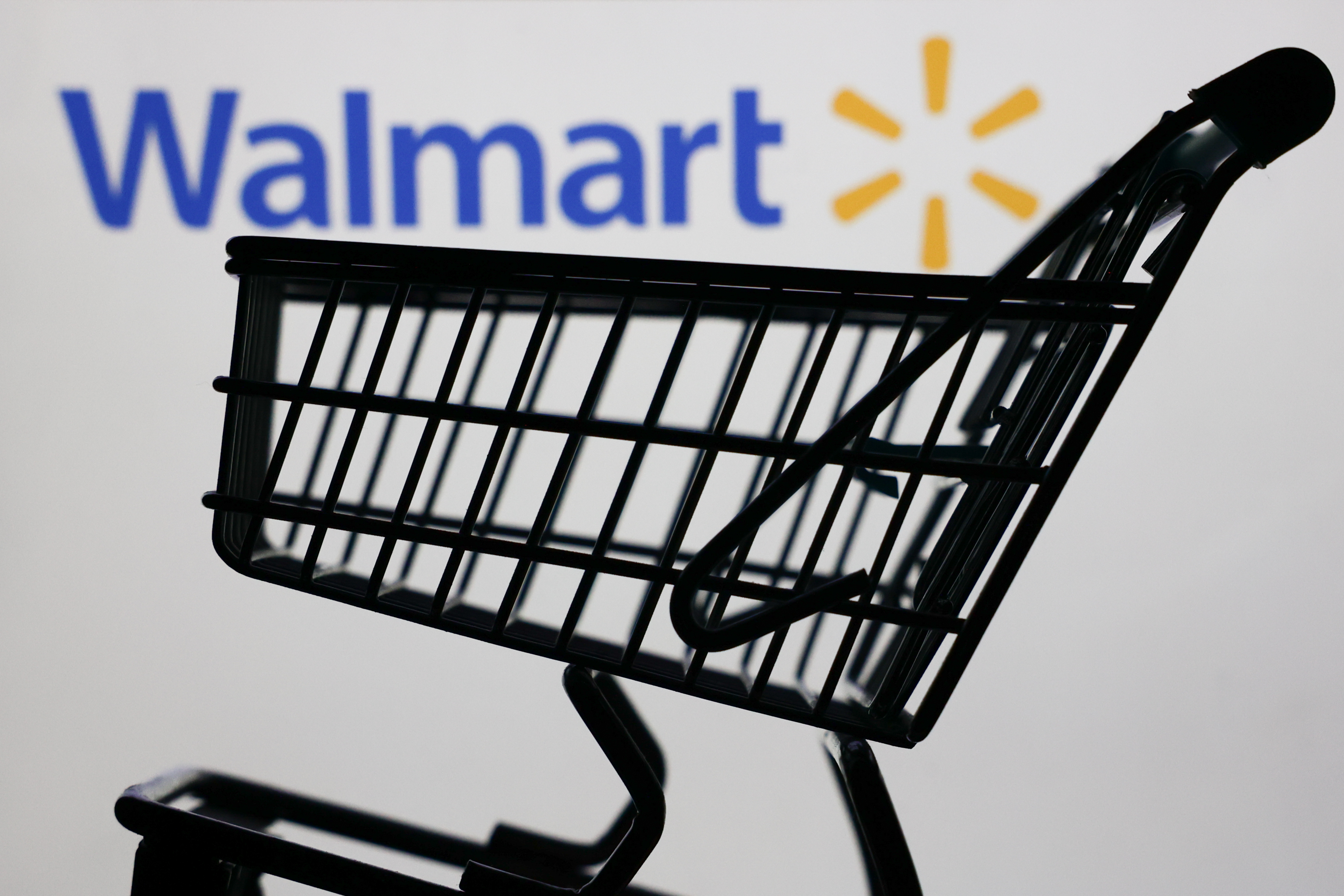 A shopping cart positioned in front of a Walmart sign in Krakow, Poland on January 6, 2025. | Source: Getty Images