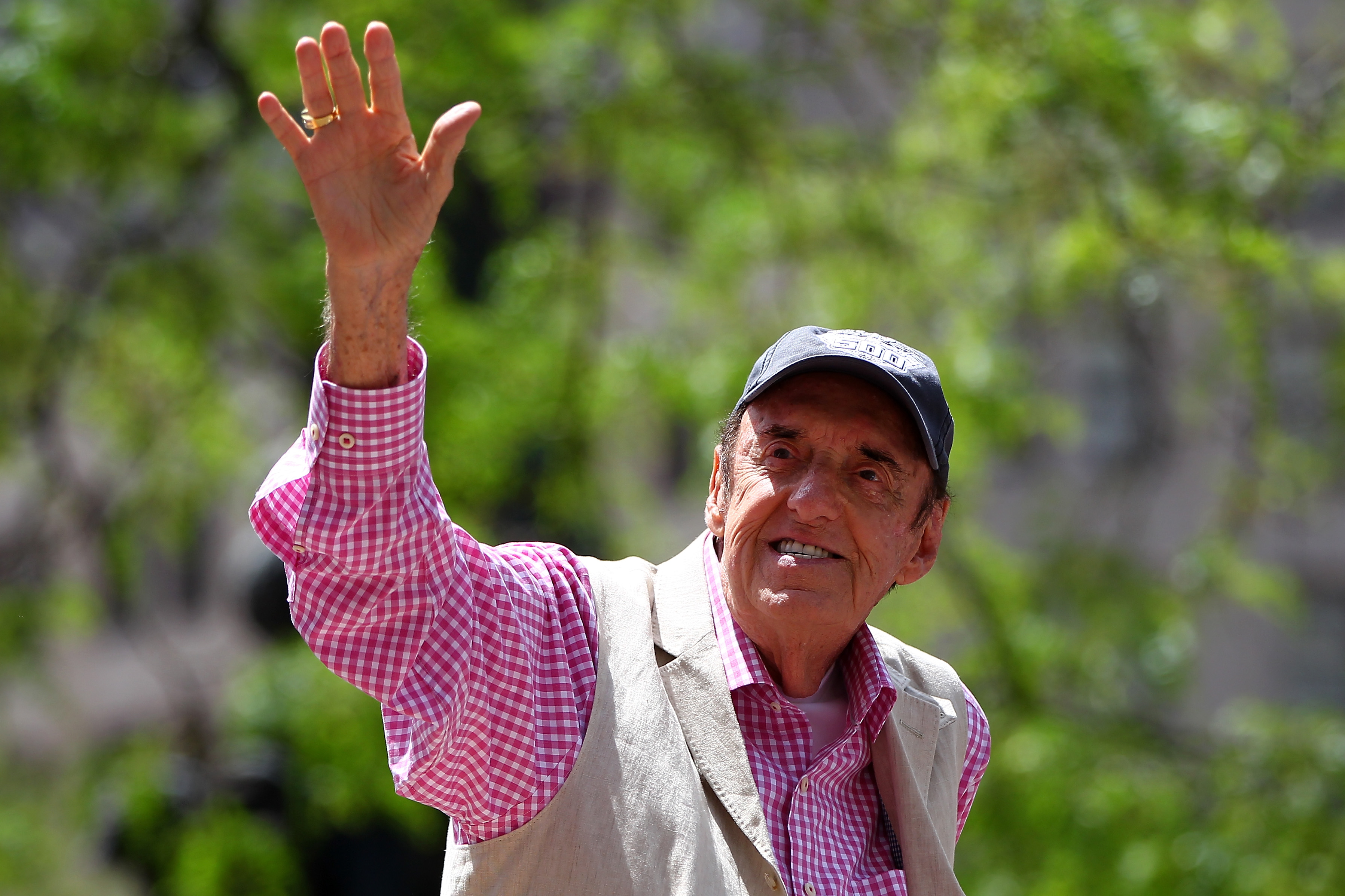 Jim Nabors waves to the crowd during the Indianapolis 500 parade on May 24, 2014, in Indianapolis, Indiana. | Source: Getty Images