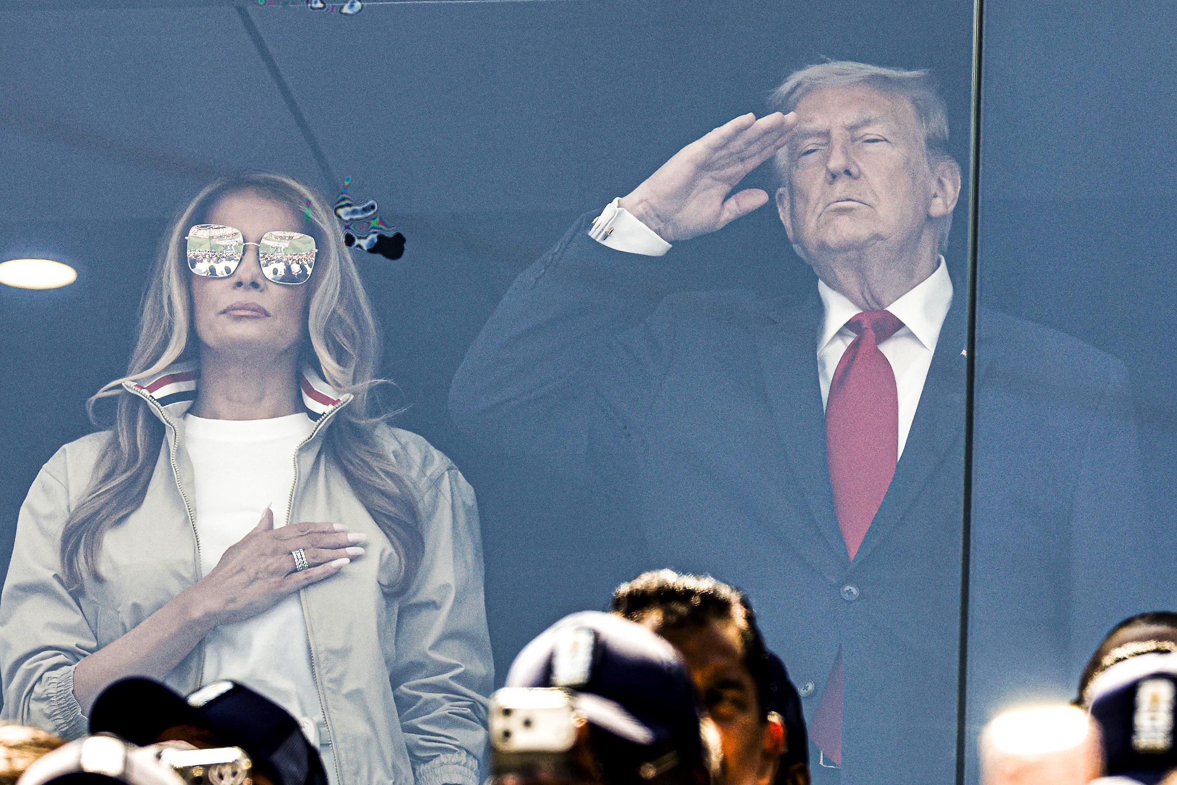 A ceremonial moment prompted fresh debate over the first lady's decision to keep her sunglasses on. The discussion soon expanded from fashion commentary into questions about etiquette and protocol. | Source: Getty Images