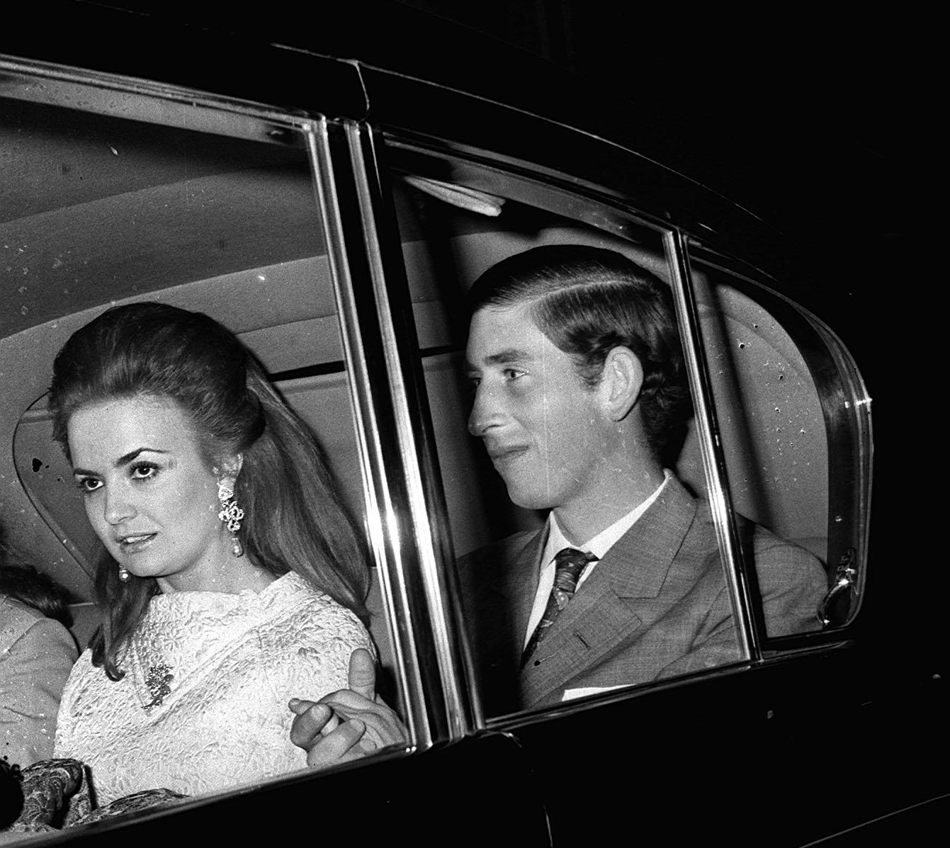 Prince Charles and Lucia Santa Cruz leaving the fortune Theatre, London, after attending a performance of David Storey's play "The Contractor" on April 16, 1970 | Source: Getty Images