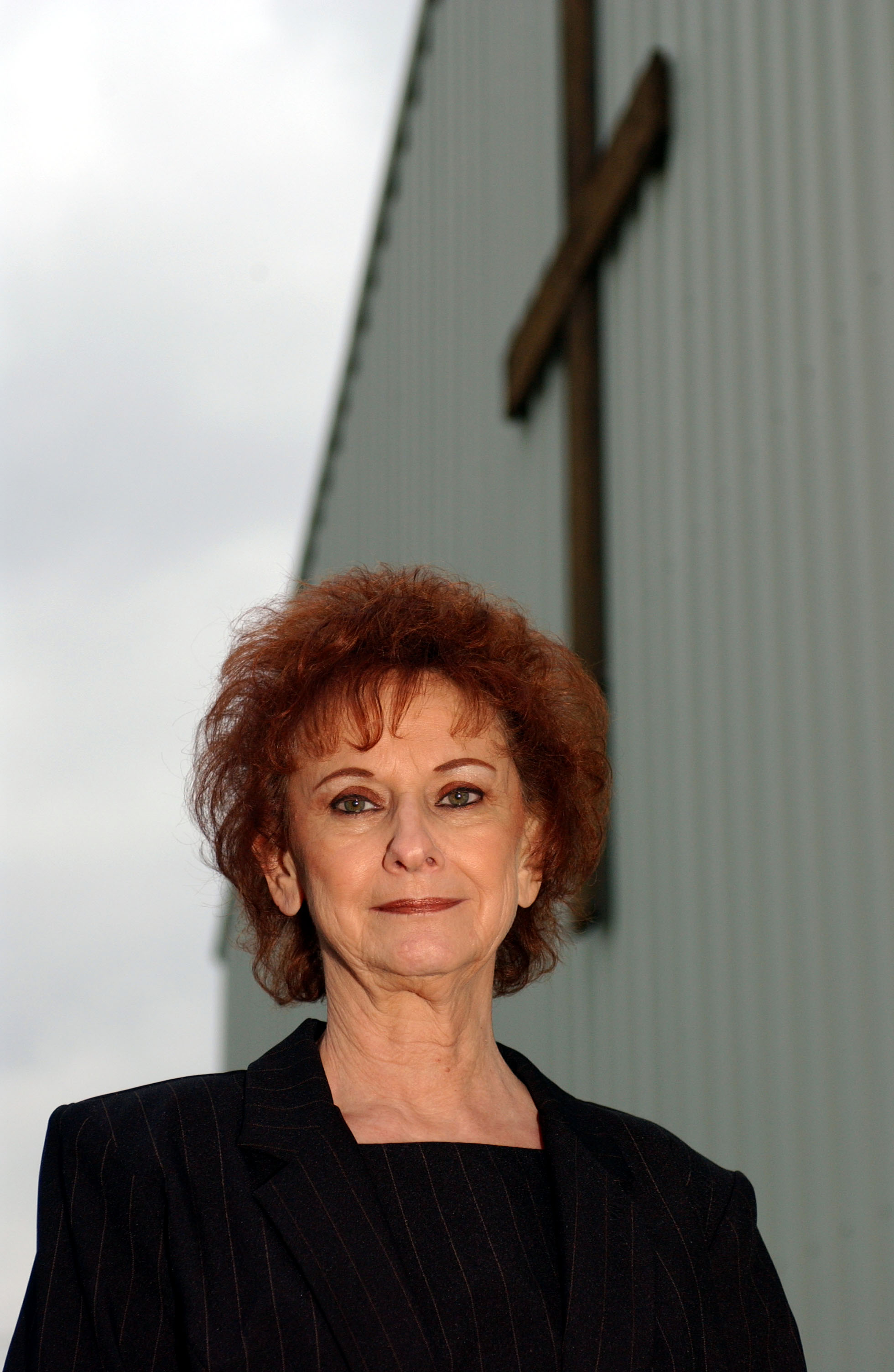 Betty Kresin, the grandmother of rap star Eminem, poses outside of a church following a memorial service for her son, Todd Nelson Sr., on October 22, 2004, in St. Joseph, Missouri. | Source: Getty Images
