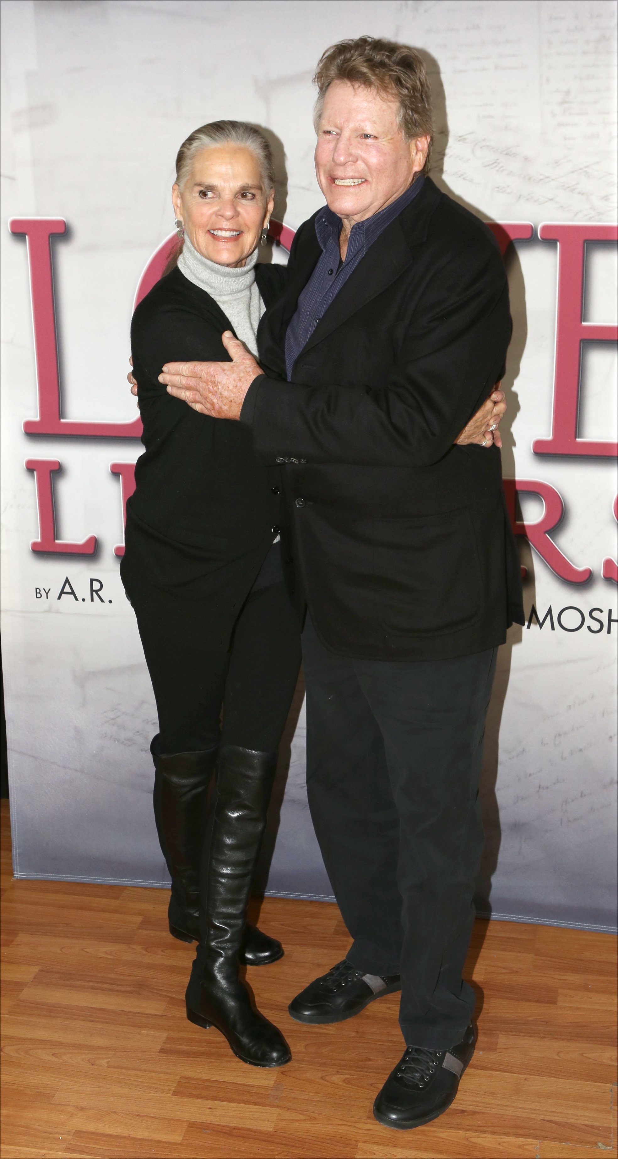 Ali MacGraw and Ryan O'Neal attend a photo call for their upcoming touring production of 'Love Letters' at The Shelter Studios Penthouse on February 24, 2015 in New York City | Photo: Getty Images
