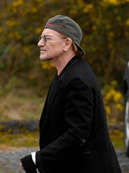 Bono was seen arriving at Moya Brennan's funeral in Donegal, wearing a black suit paired with a casual cap in a post dated 17 April 2026. | Source: Facebook/Irish Daily Mirror