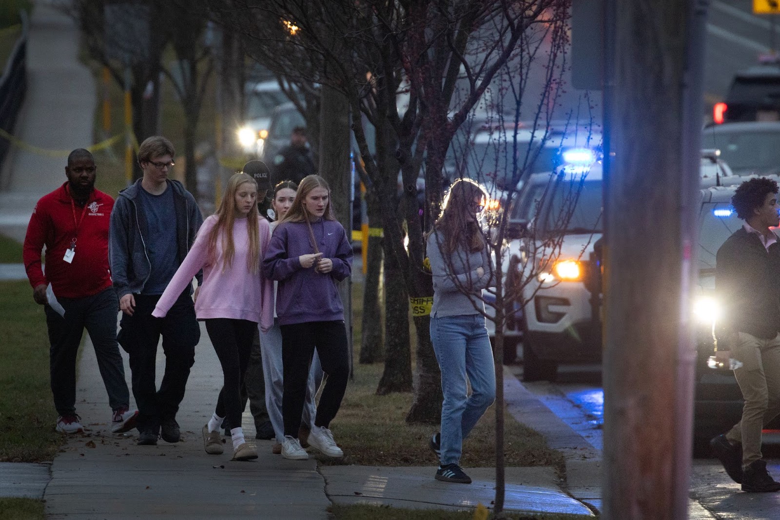 Students escorted from a church next to the Abundant Life Christian School and loaded on buses to be taken to a reunification center on December 16, 2024. | Source: Getty Images