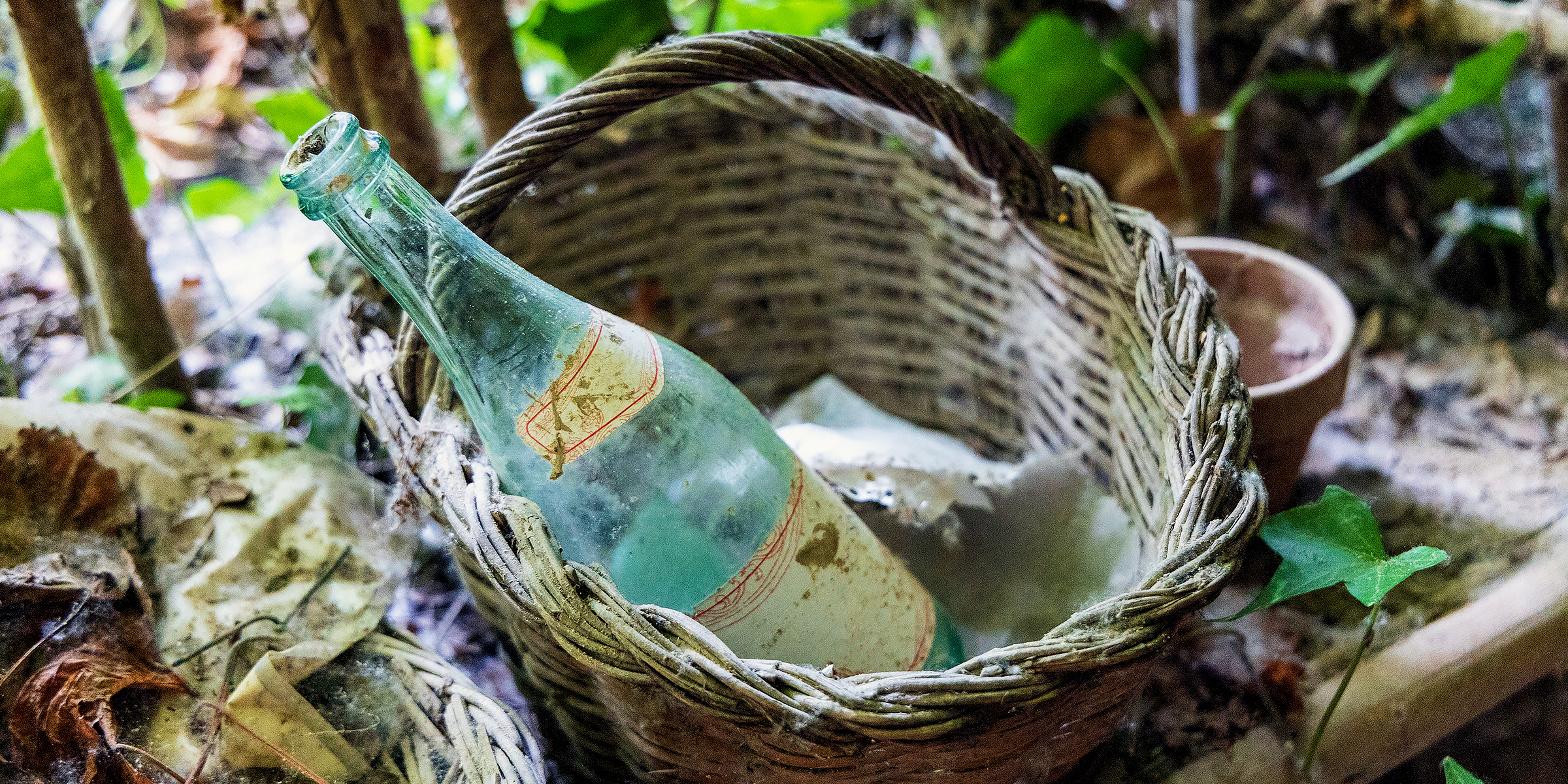 An old glass bottle in a basket | Source: Getty Images