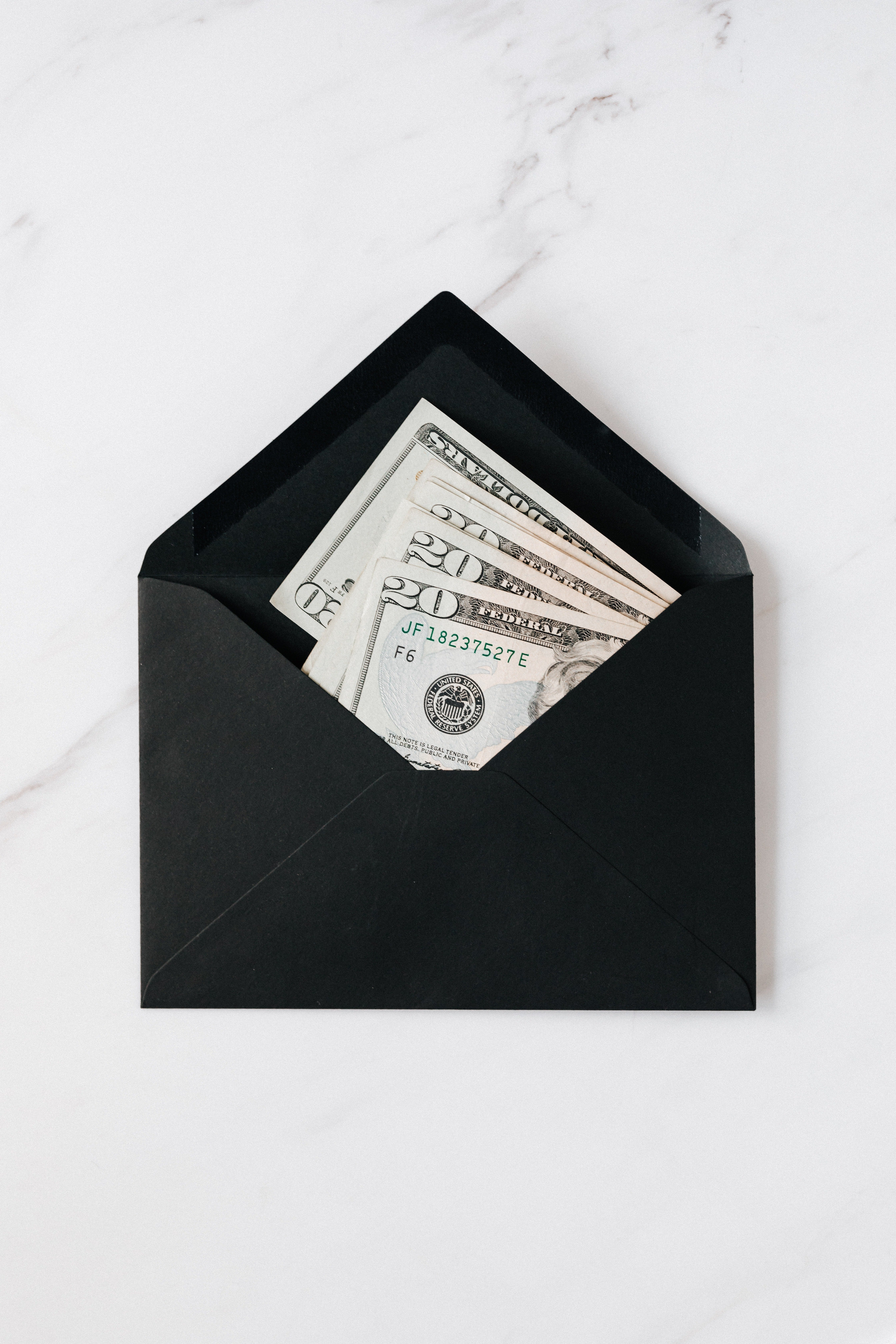 A photo of money in a black envelope. | Source: Pexels/ Karolina Grabowska