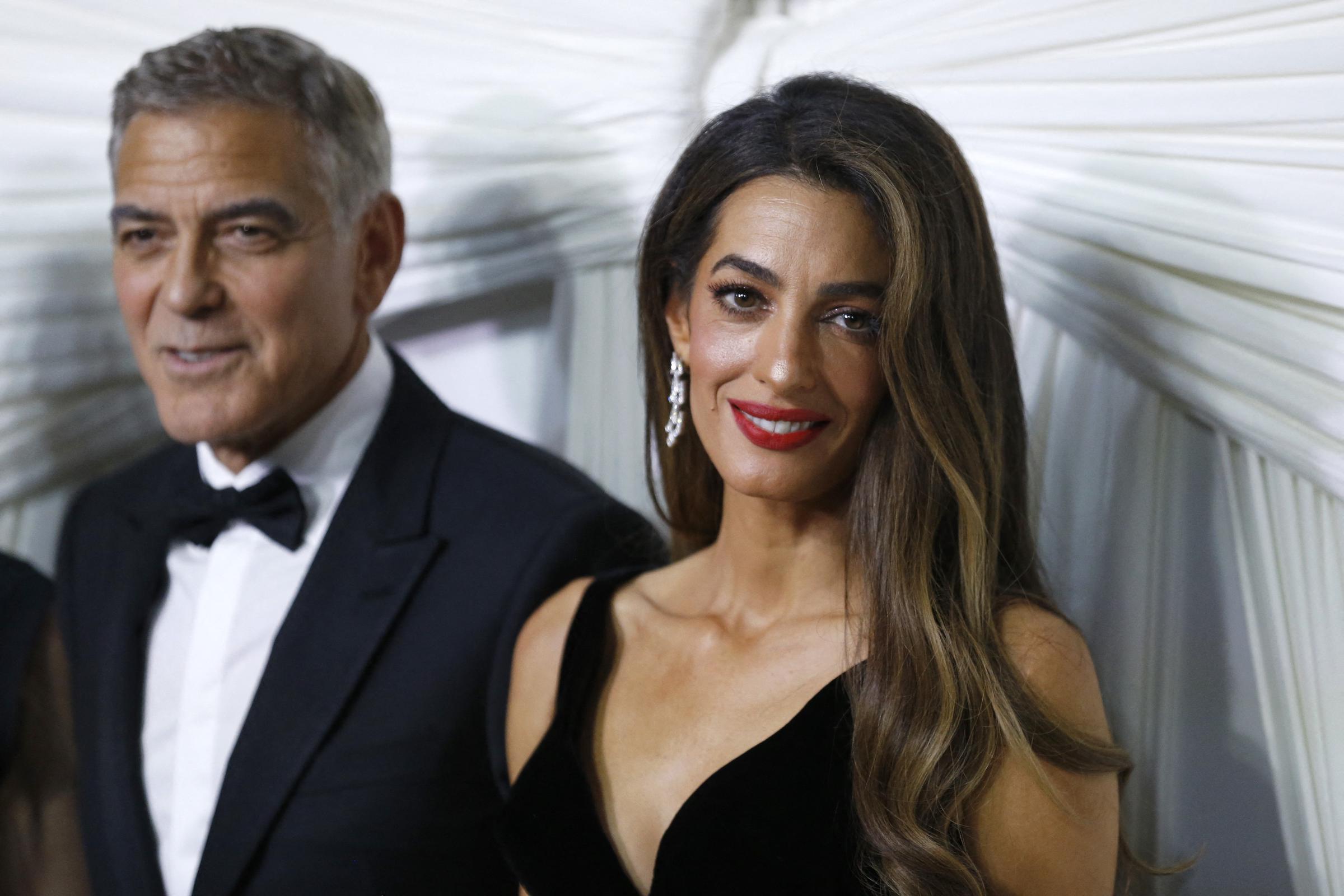 George and Amal Clooney arrive for "The Albies" hosted by the Clooney Foundation for Justice at the New York Public Library in New York, on September 26, 2024 | Source: Getty Images