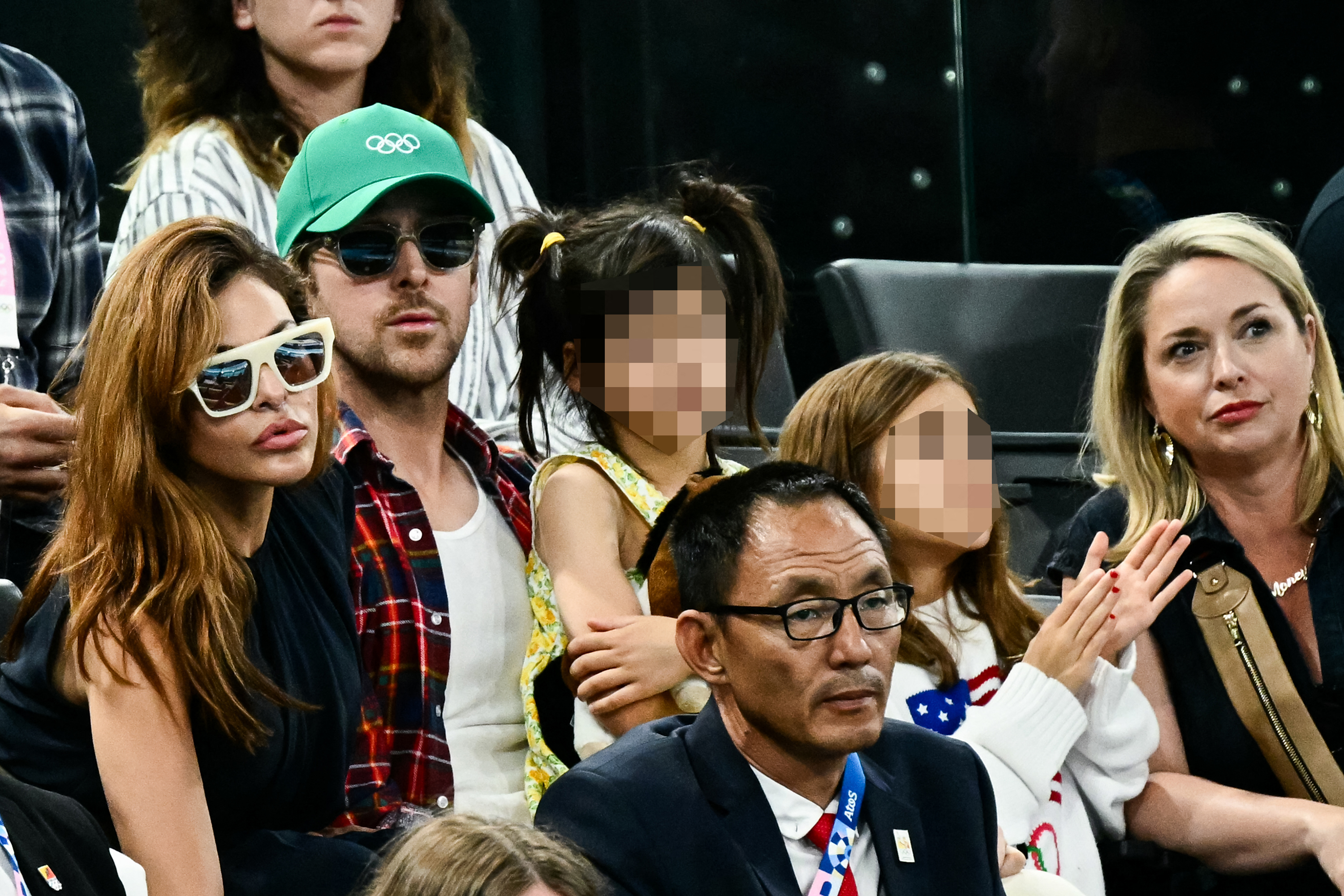 Eva Mendes and Ryan Gosling, along with their daughters Esmeralda and Amada, watch the women’s uneven bars final at the 2024 Paris Olympics on August 4, 2024 | Source: Getty Images