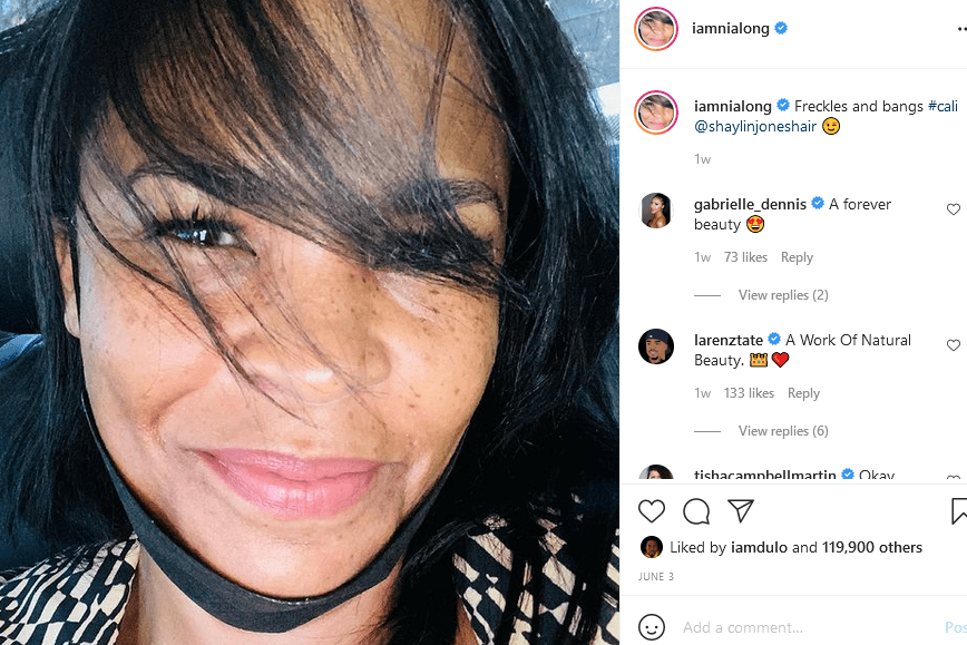 Nia Long shows off her freckles and pretty smile in a picture taken in a car | Photo: Instagram/iamnialong