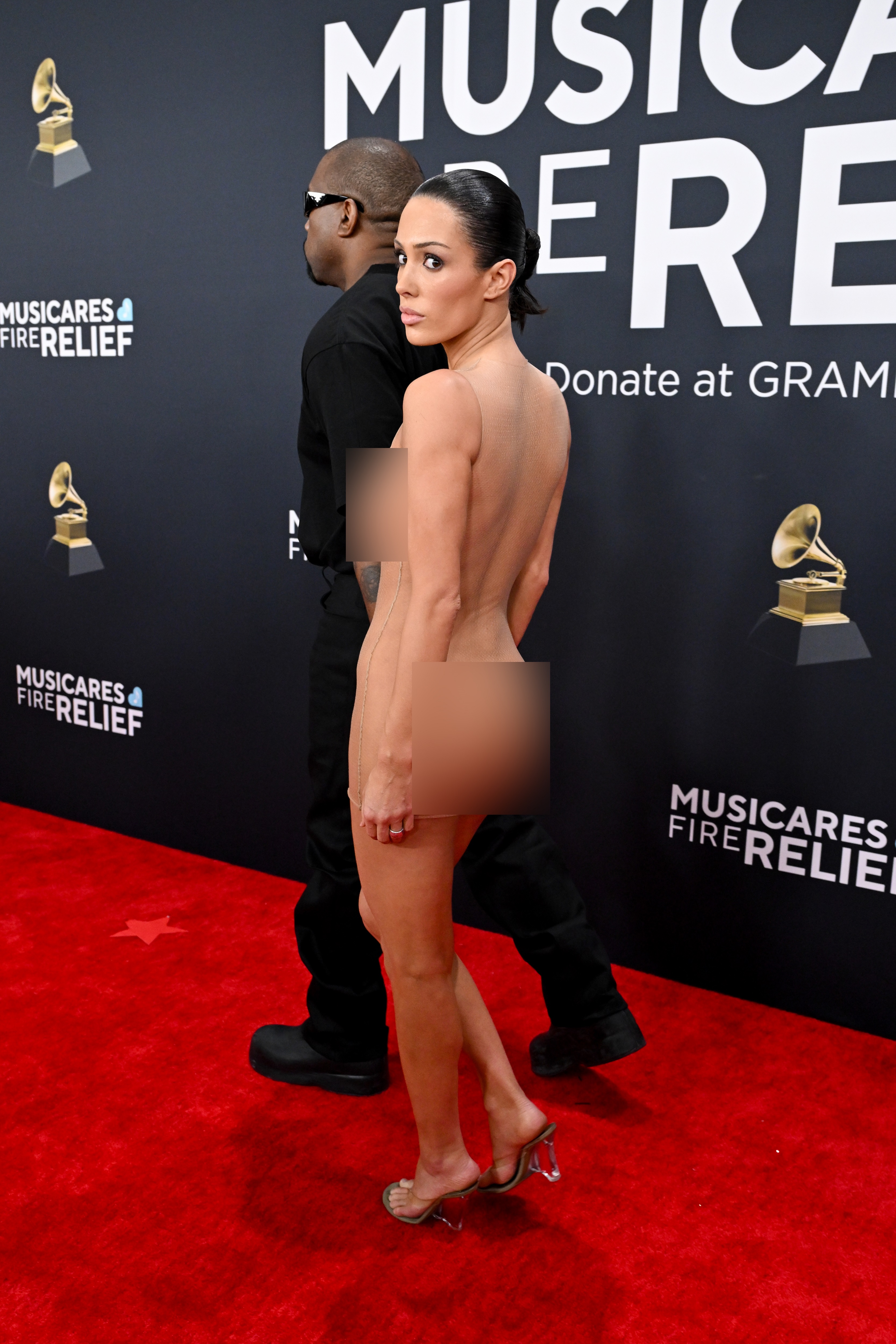 Kanye West and Bianca Censori (whose outfit has been blurred) attend the 67th GRAMMY Awards on February 2, 2025, in Los Angeles, California | Source: Getty Images