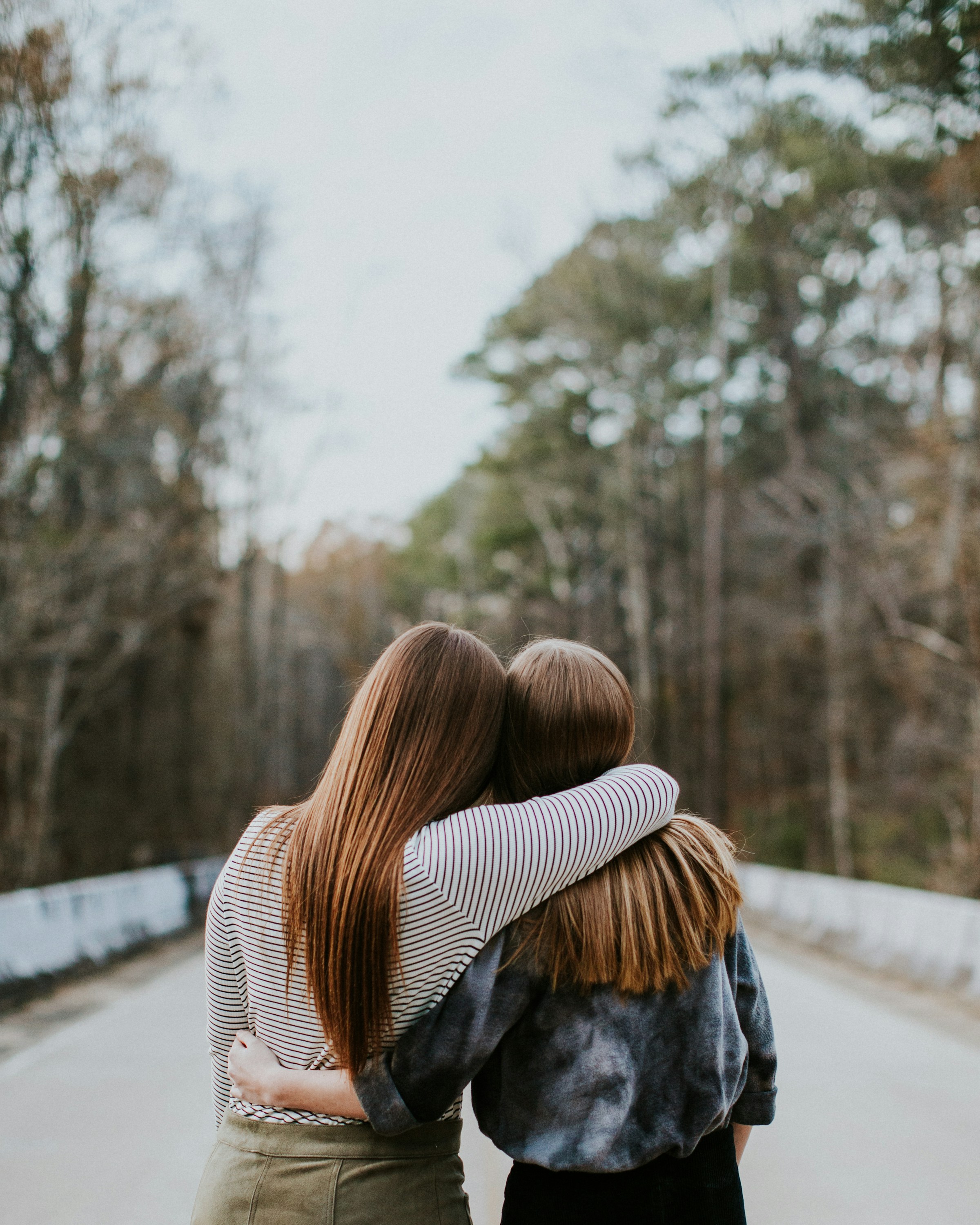 Two women holding each other | Source: Unsplash