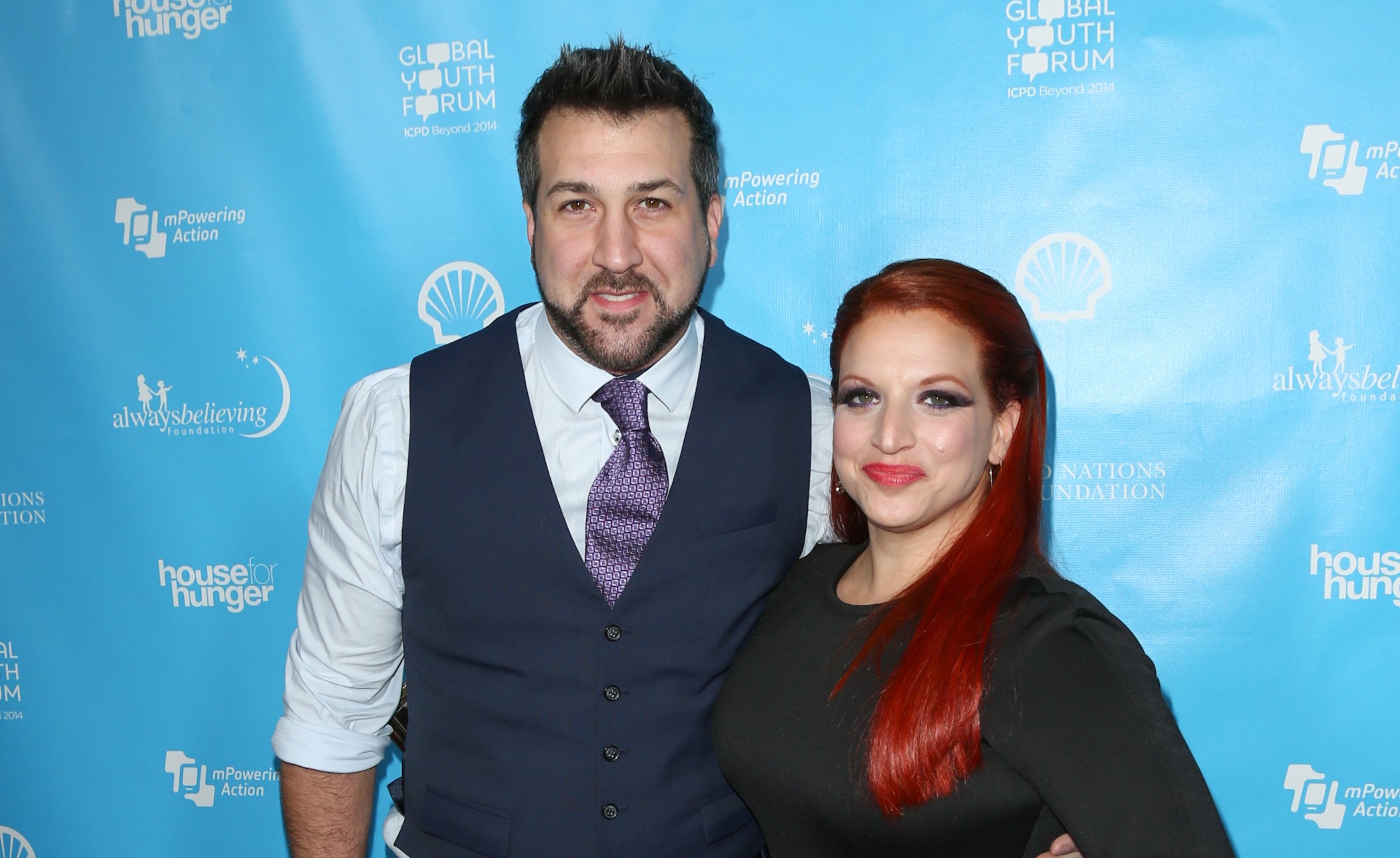 Producer Joey Fatone and writer Kelly Baldwin at the launch of mPowering Action at The Conga Room at L.A. Live, on February 8, 2013, in Los Angeles, California. | Source: Getty Images