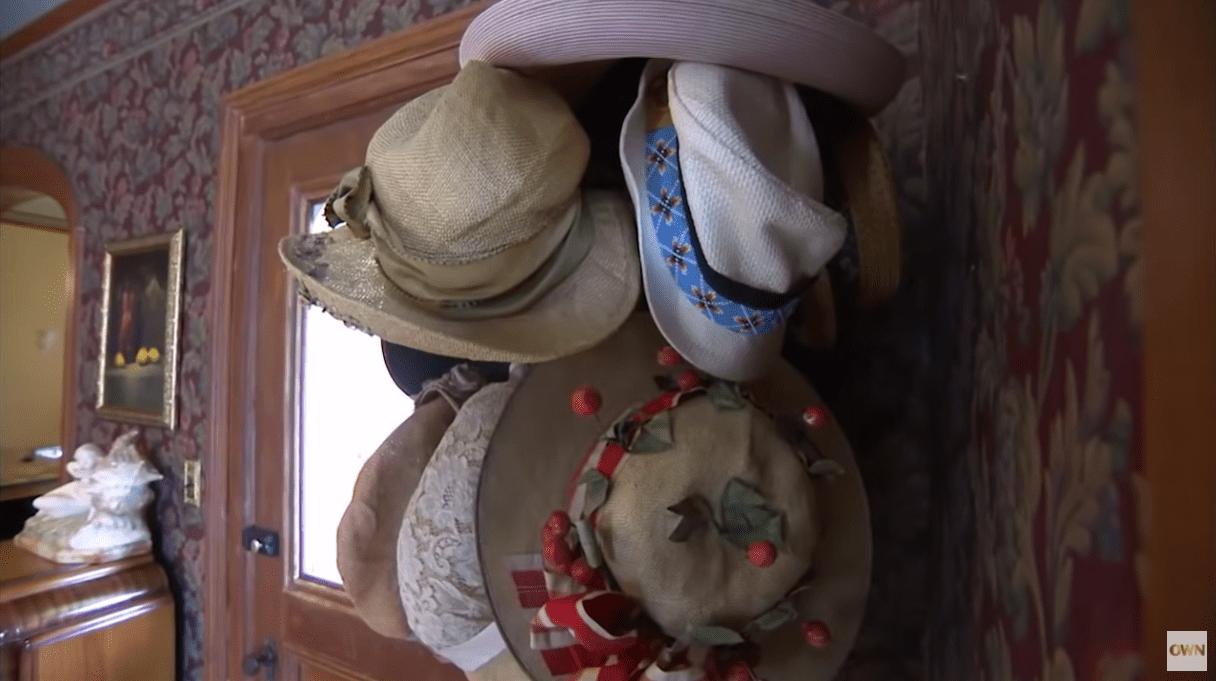 Pictured: A collection of Melissa Gilbert's hats hung up on the wall for display. / Source: YouTube/@OWN 
