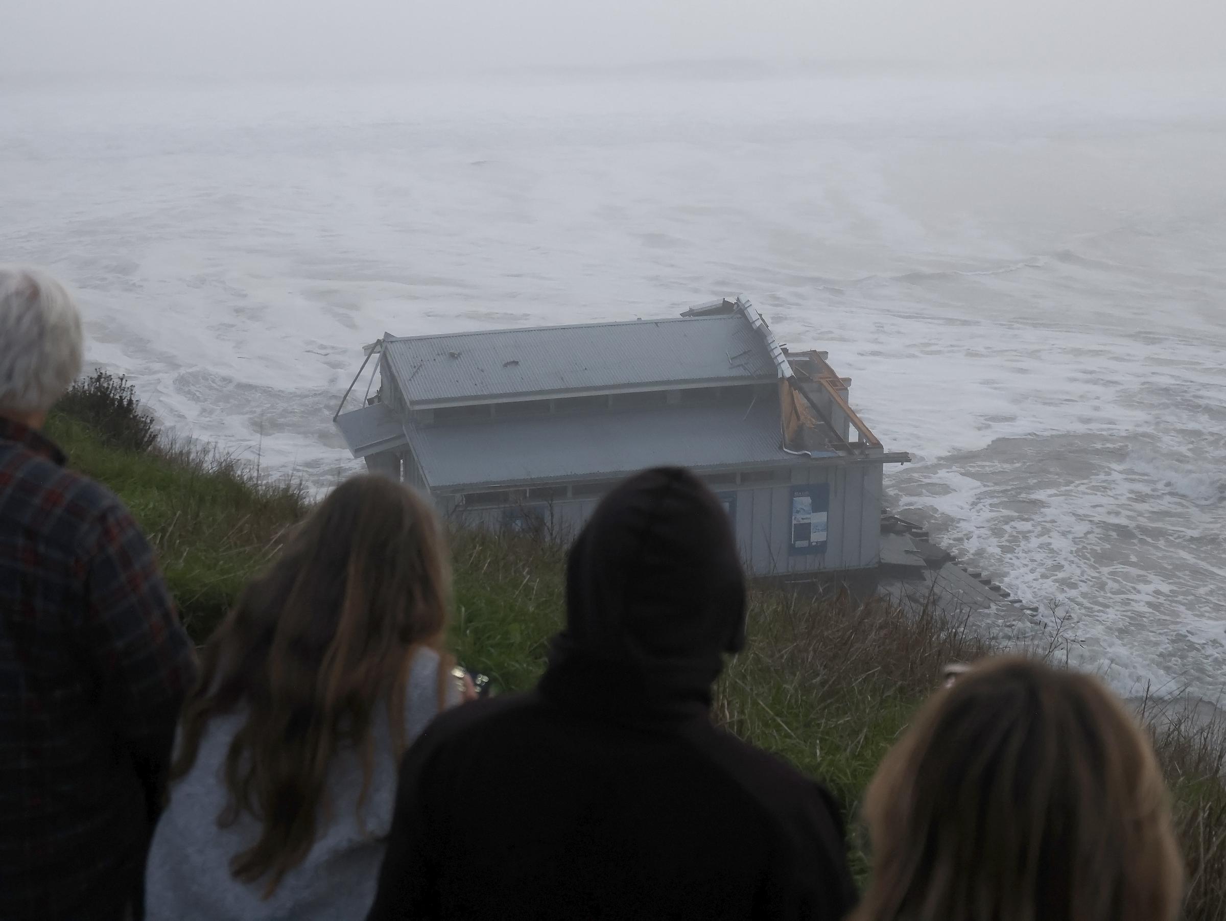 People look at the collapsed pier at the Santa Cruz Wharf in Santa Cruz, California, on December 23, 2024 | Source: Getty Images