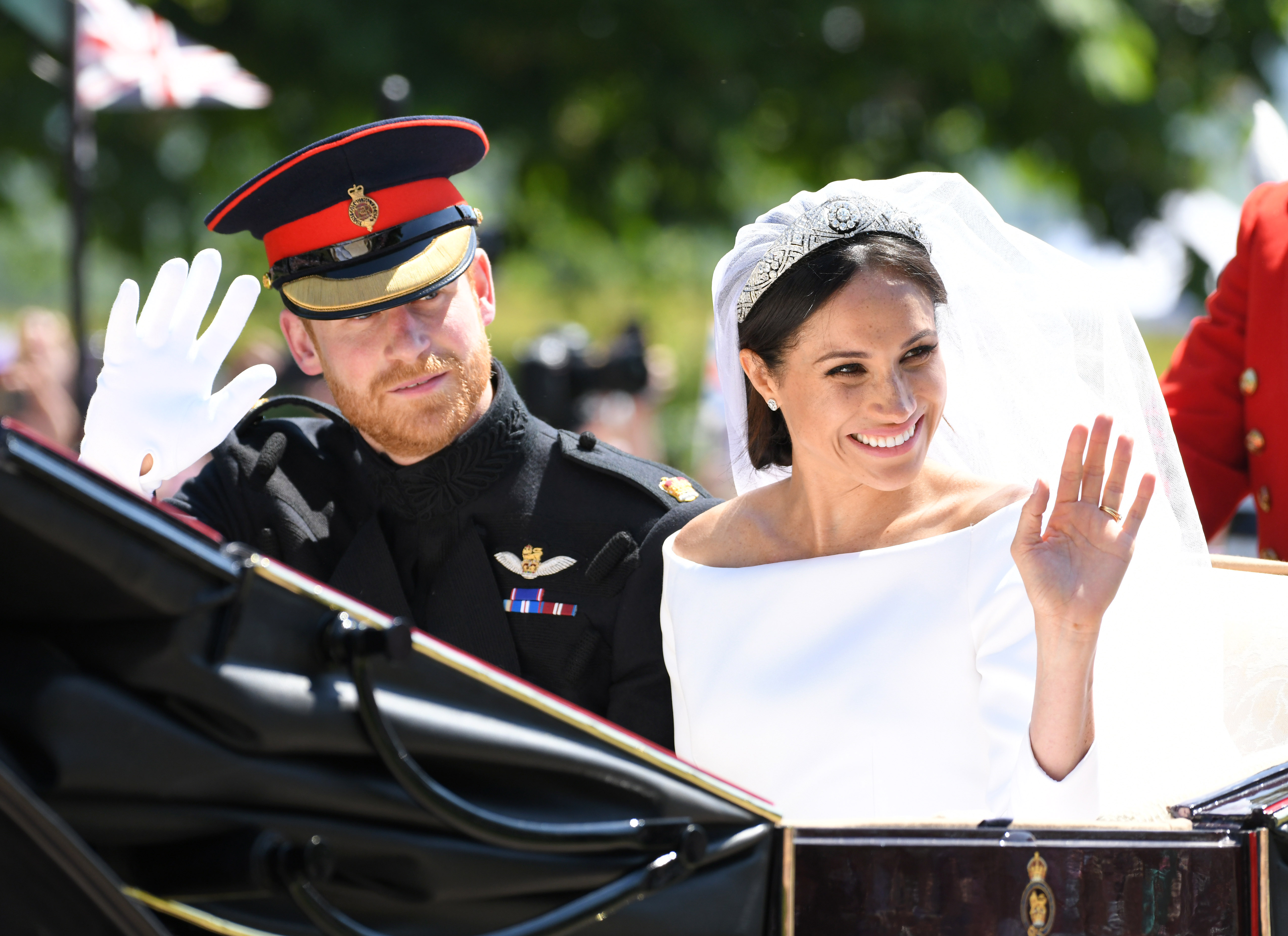 Prince Harry and Meghan Markle leave Windsor Castle in a carriage after their wedding at St George's Chapel on May 19, 2018. | Source: Getty Images