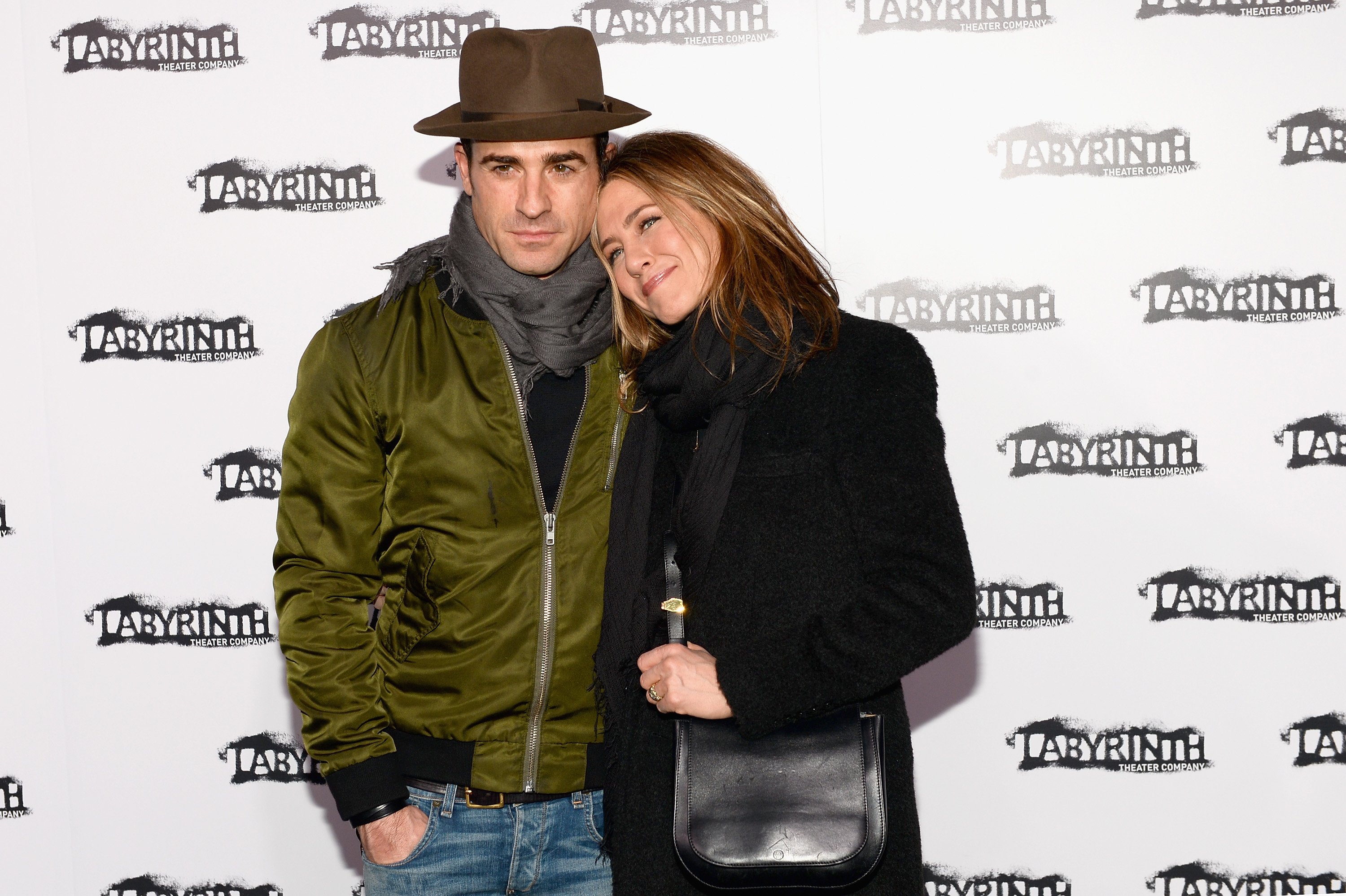 Jennifer Aniston posed with Justin Theroux at the Labyrinth Theater Company’s Celebrity Charades Gala in New York City in November 2015. She wore a black coat and scarf, leaning her head gently on his shoulder for the photo.