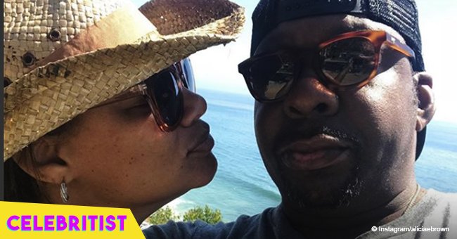 Bobby Brown's wife sizzles in one-piece bathing suit while paddle surfing in Hawaii