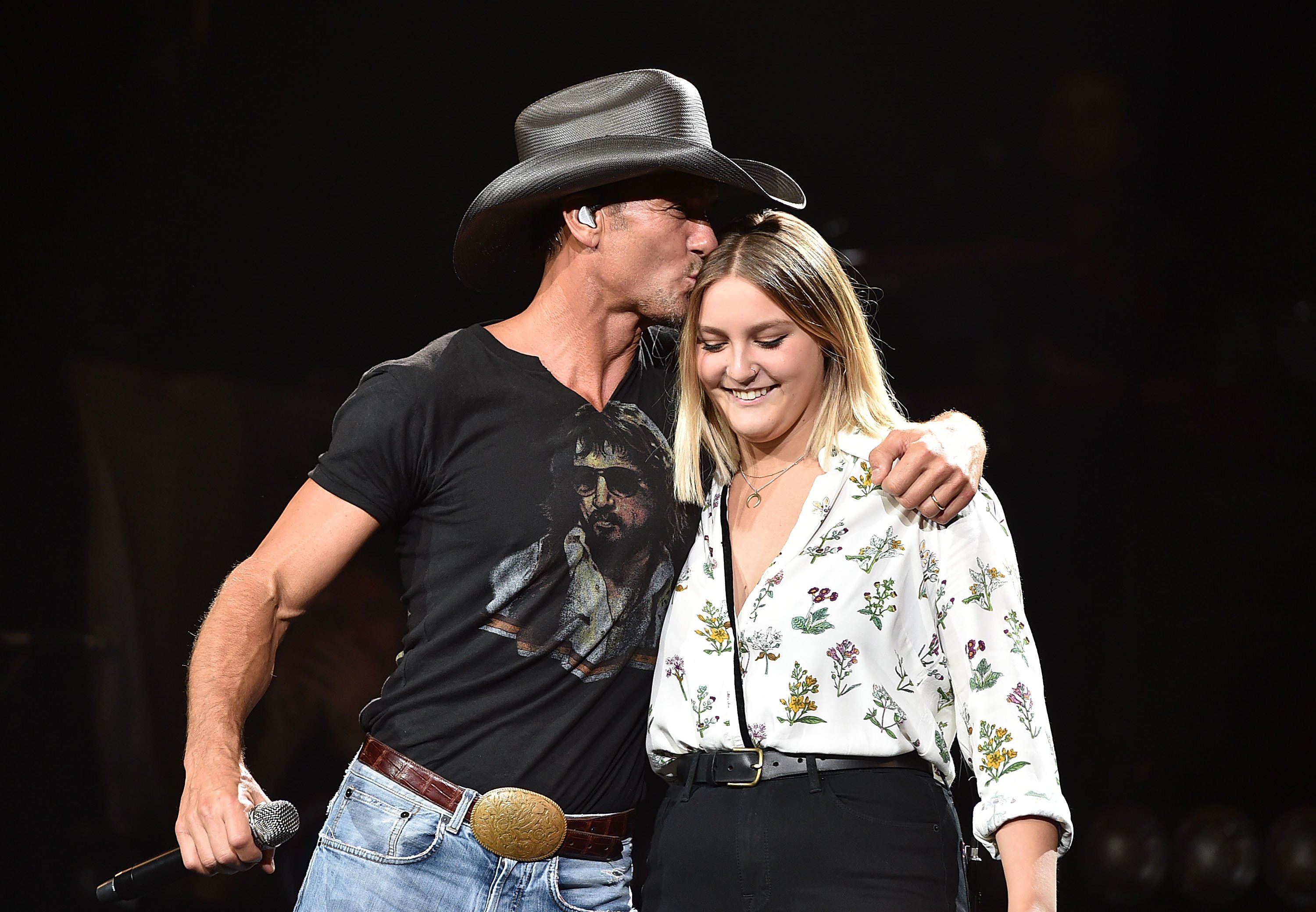 Tim McGraw performs with his daughter Gracie McGraw on the "Shotgun Rider" tour at Bridgestone Arena, on August 15, 2015, in Nashville, Tennessee. | Source: Getty Images 